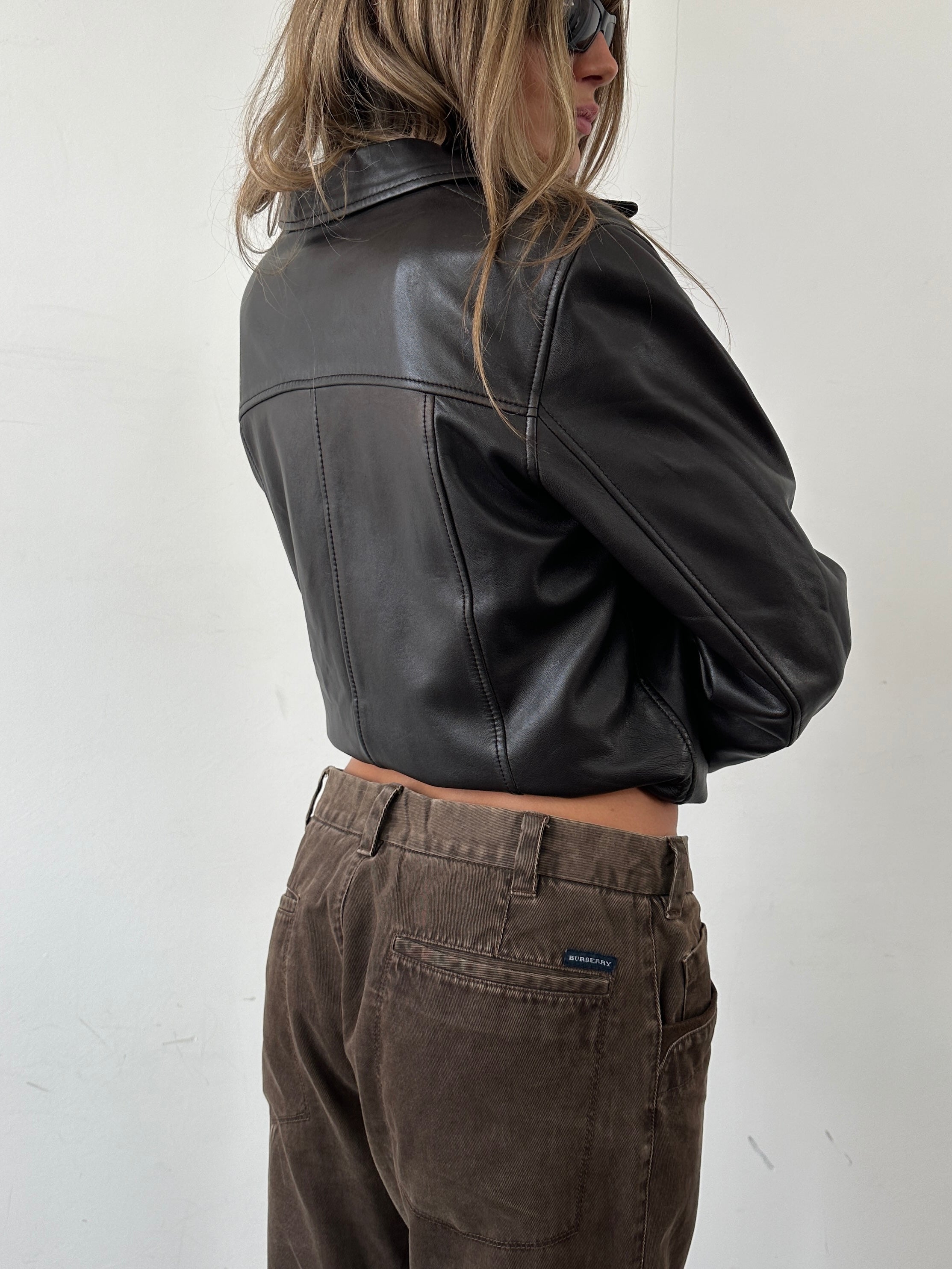 Conbipel men's button-up leather jacket in size S, featuring classic design and smooth black leather fabric.