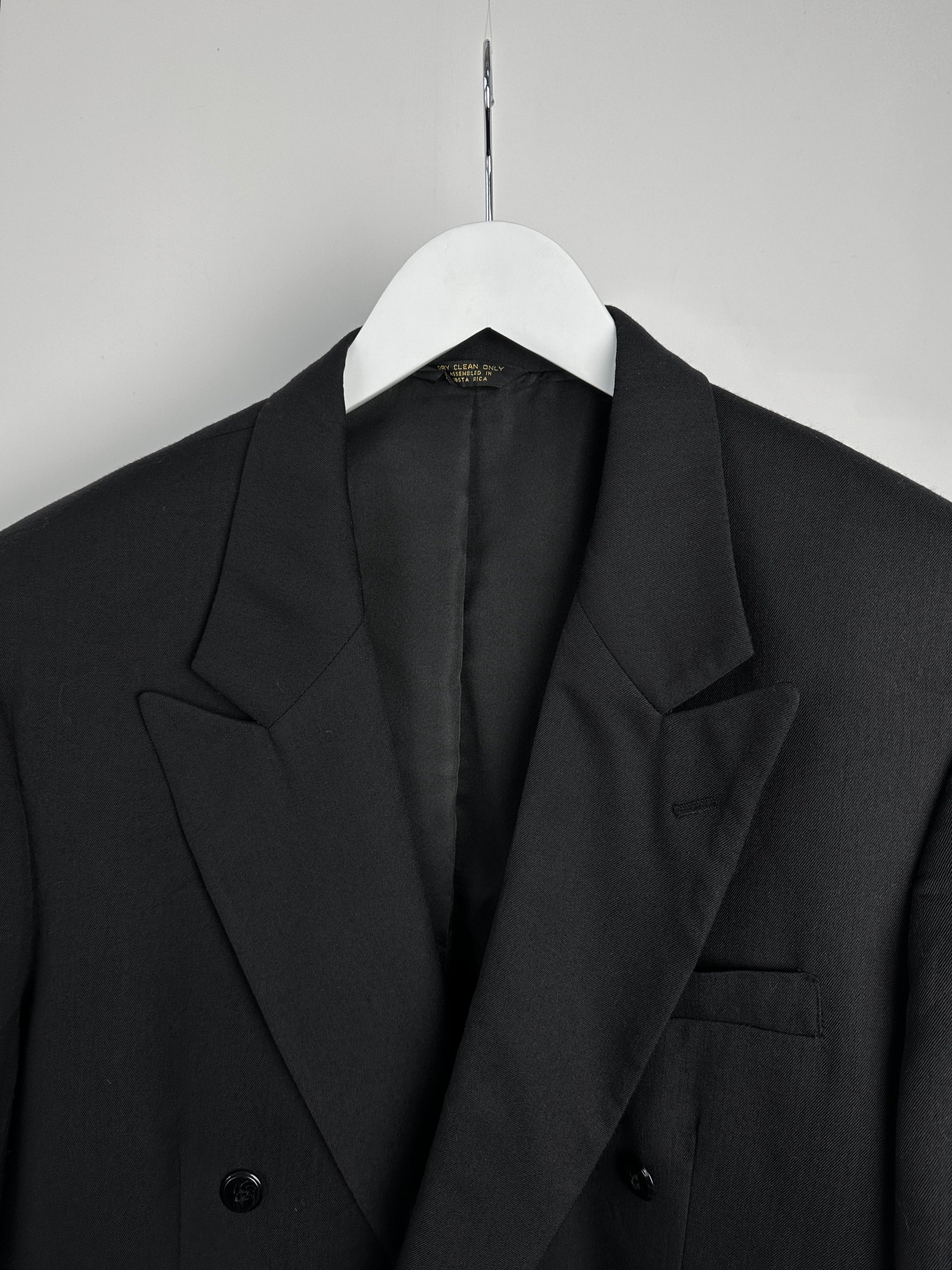 Vintage wool double-breasted blazer in size 40L, featuring classic tailored design and structured fit.