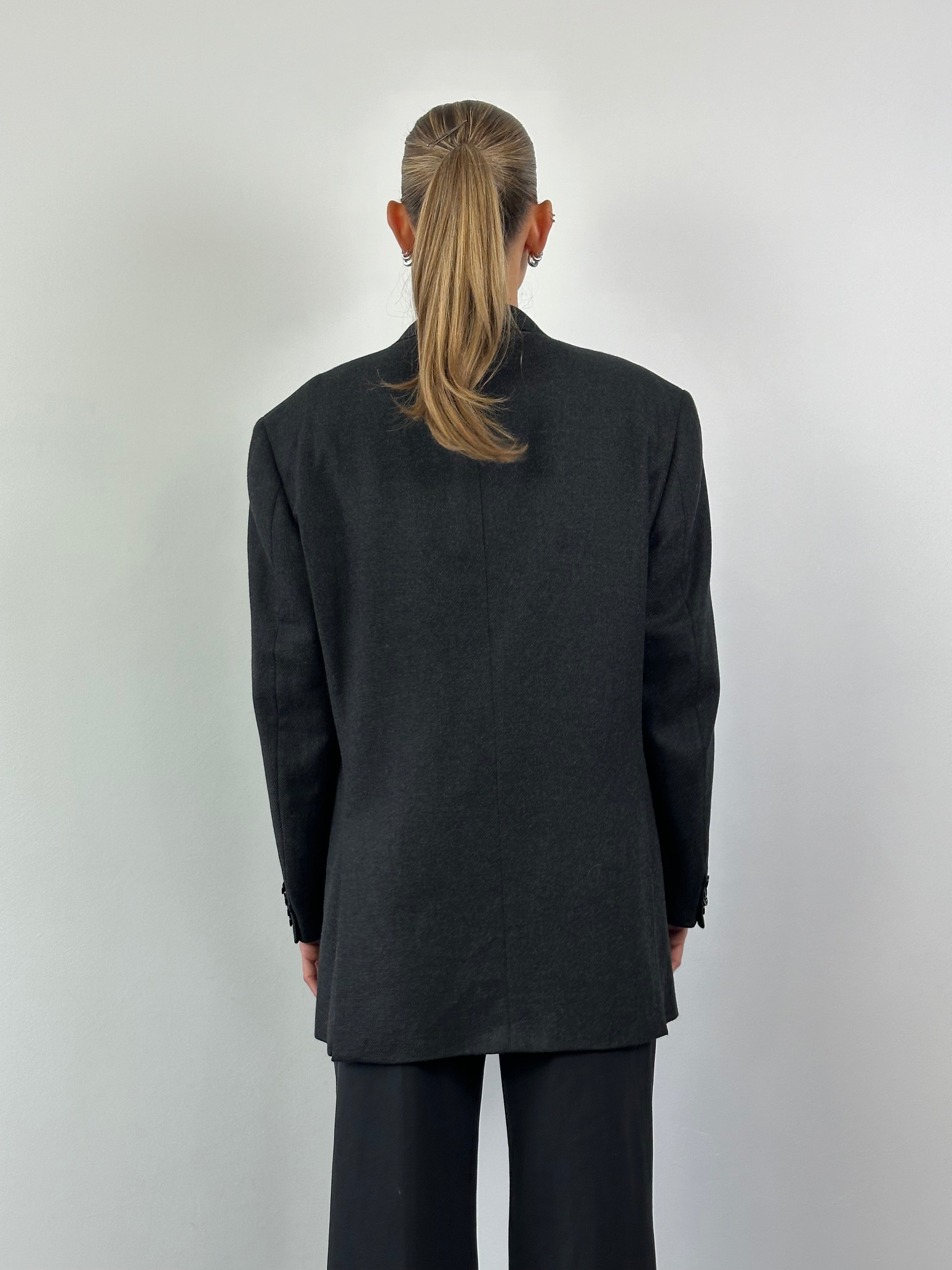 Loro Piana wool cashmere single-breasted blazer in size 40R/L, tailored fit, dark navy color, classic lapel design.