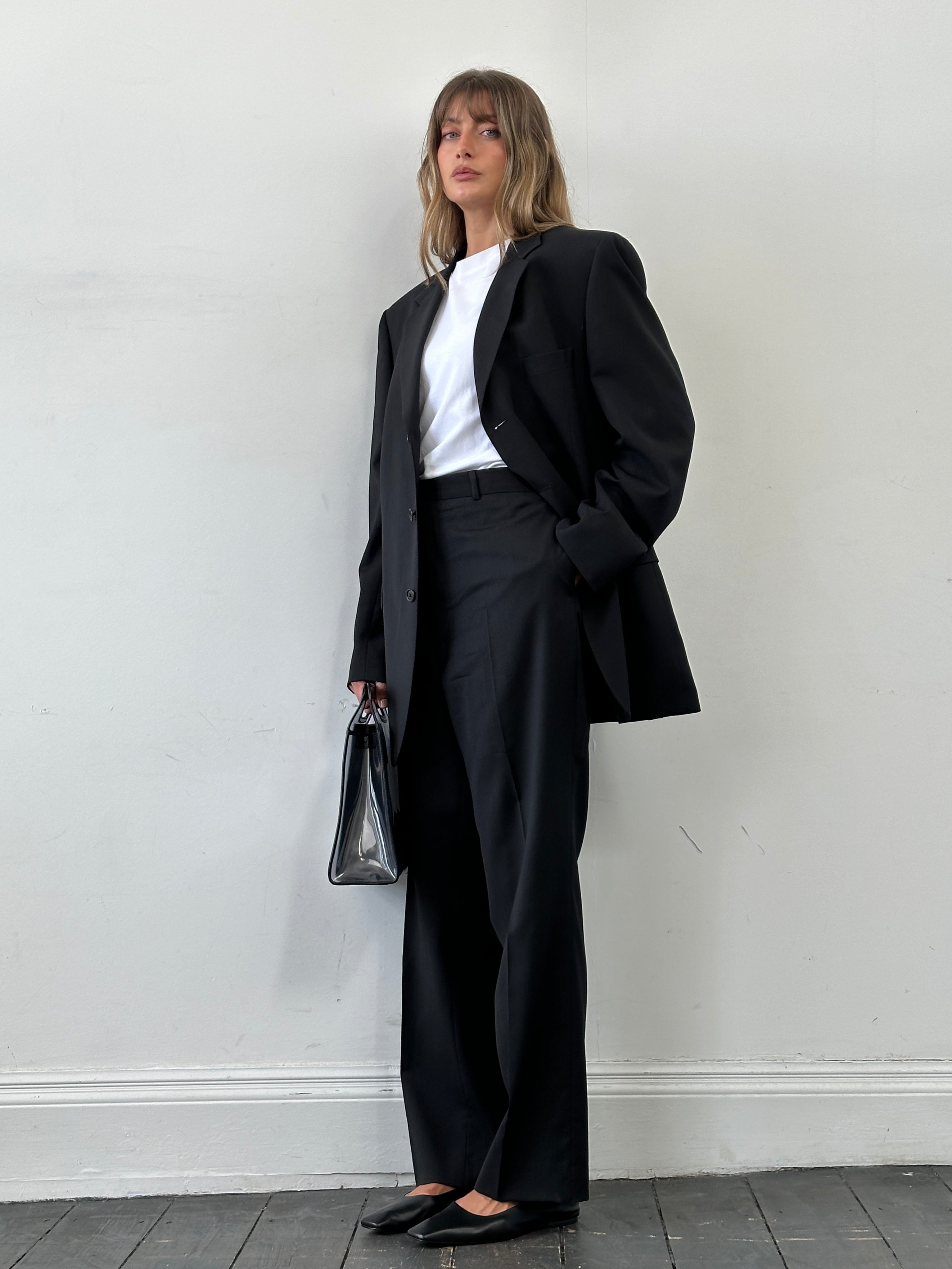 Yves Saint Laurent Pour Homme single-breasted wool jumpsuit in size 46R/W38, tailored fit with lapel collar and classic design.
