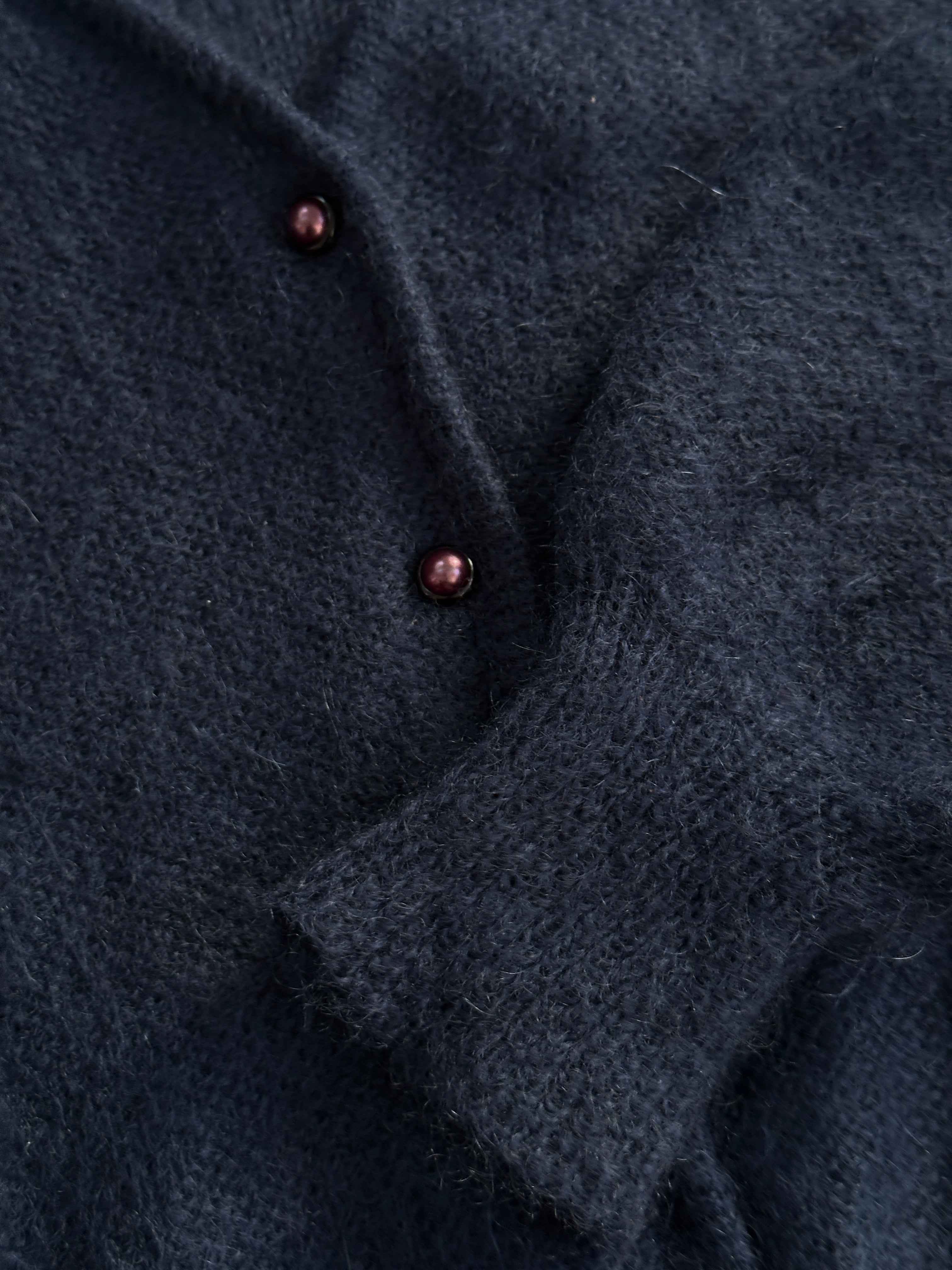 Vintage Italian vintage mohair cardigan in size M, soft knit with a classic design, shown hanging on a wooden hanger.