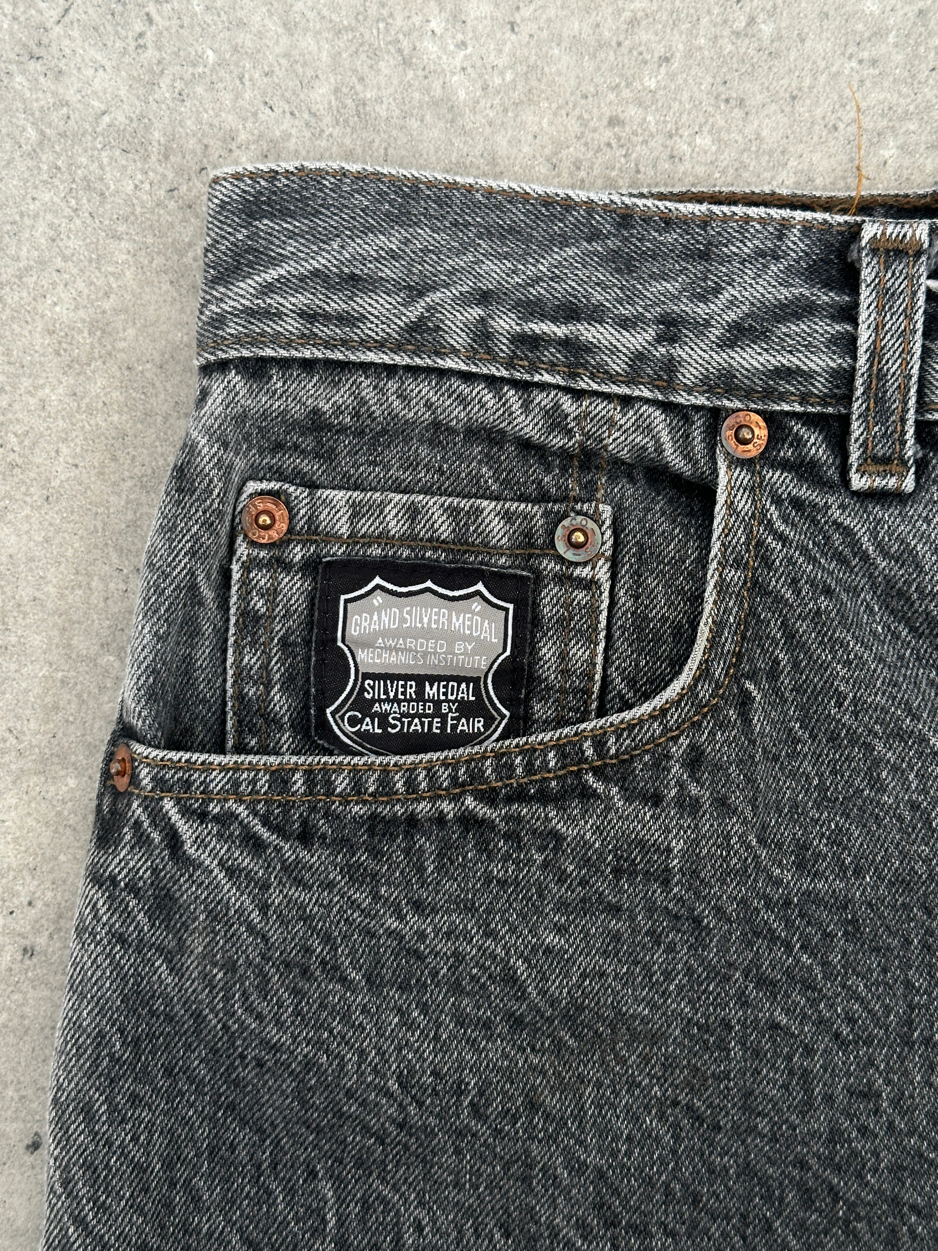 Levi’s 80s 727 Silver Tab loose fit denim jeans in W30, showcasing classic distressed look and relaxed fit style.