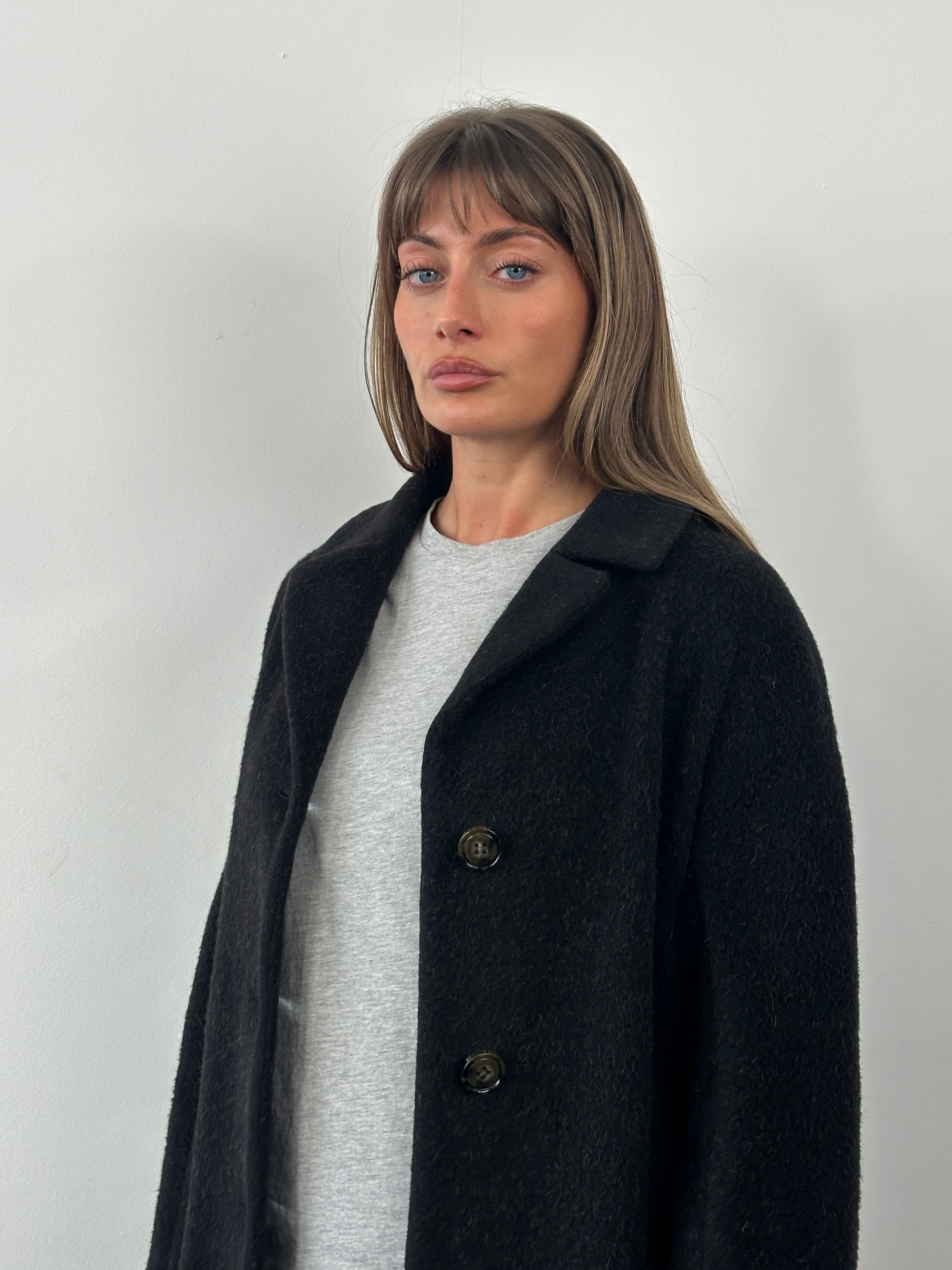 Max Mara wool and mohair single-breasted coat from the 1990s, in a classic style, displayed on a hanger.