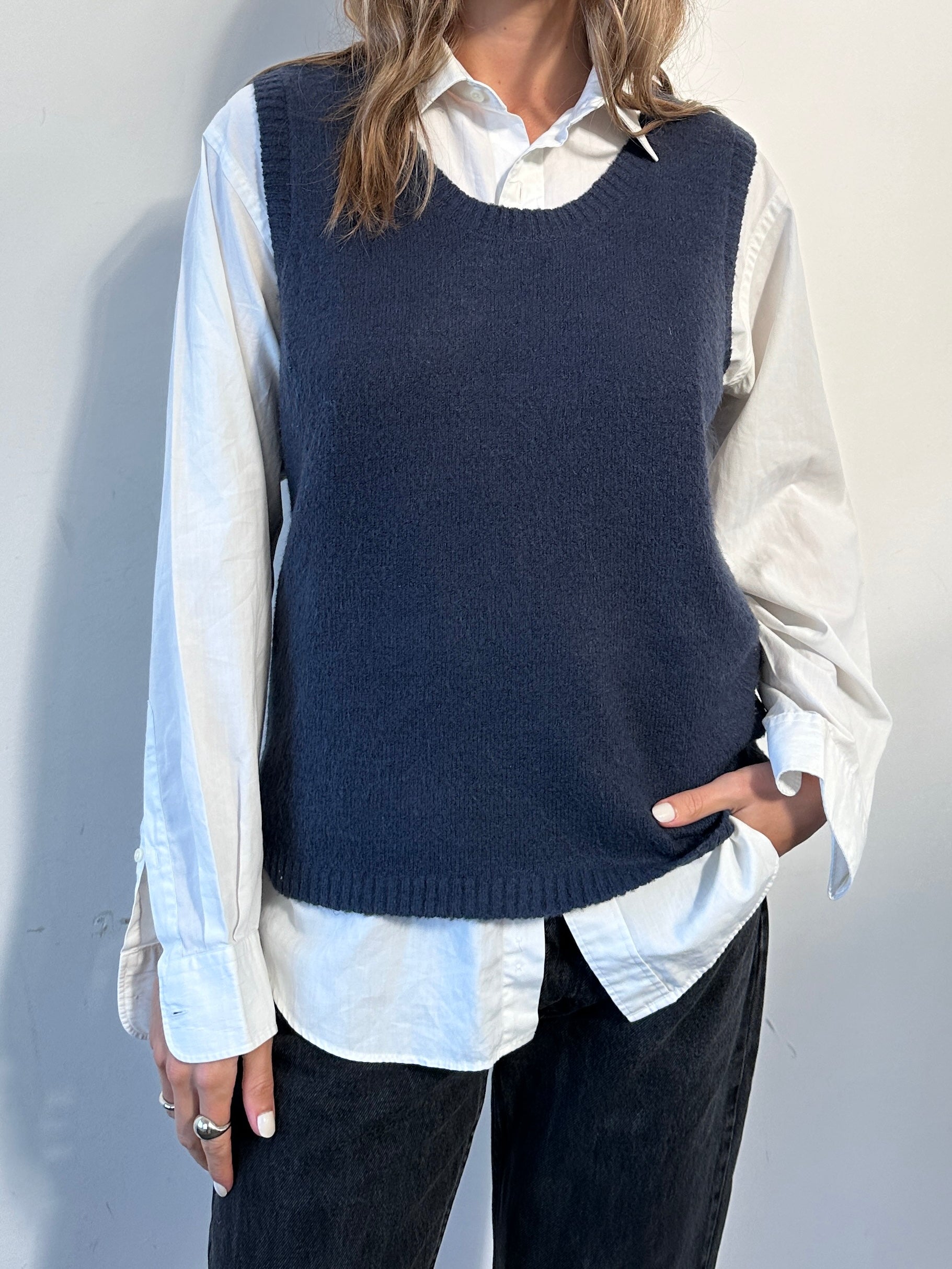 Vintage brand knit sleeveless vest in size large, featuring a classic vintage design with ribbed knit texture.
