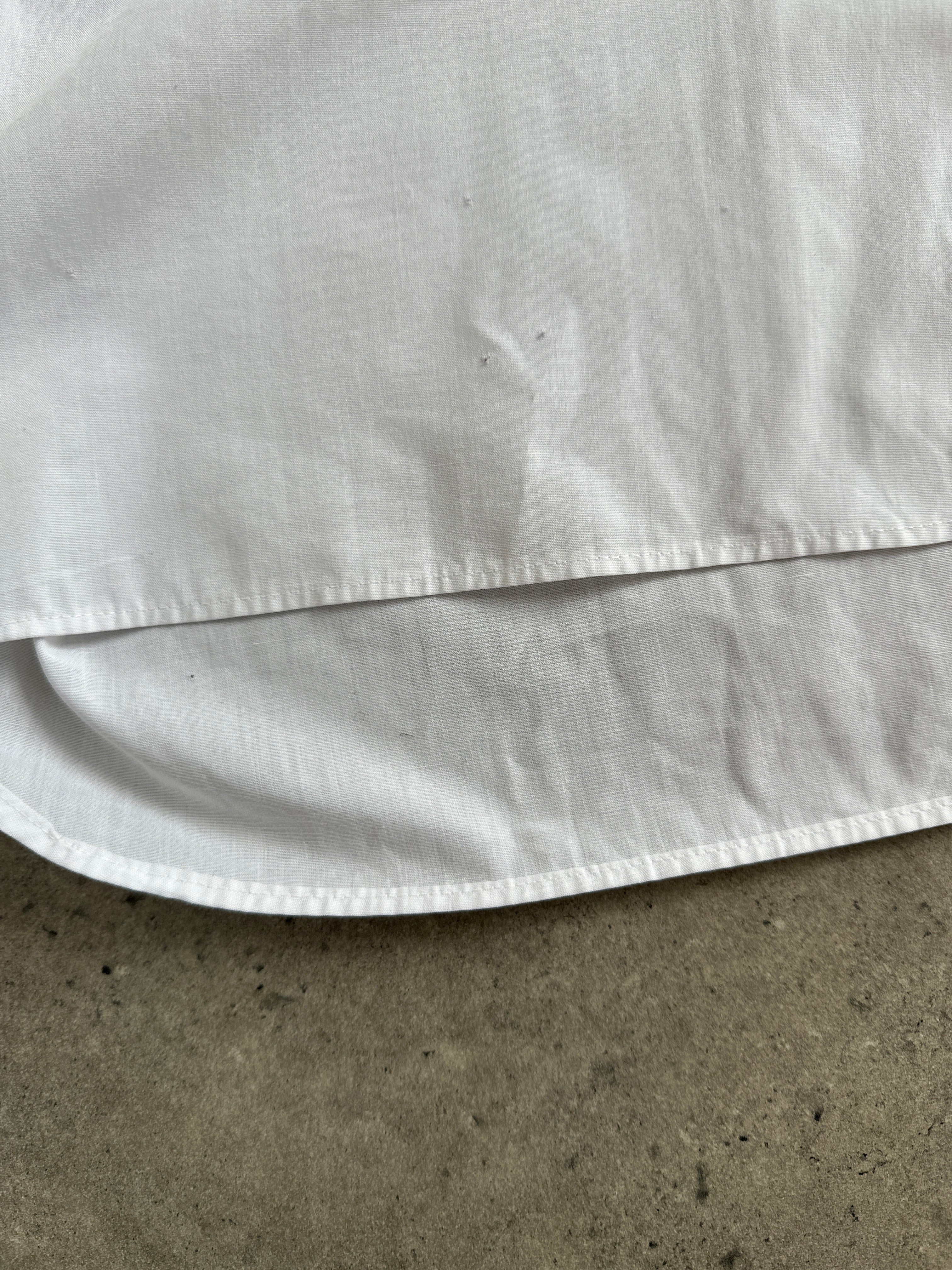 Christian Dior cotton dress shirt in size L, showcasing a classic white button-up shirt with a crisp collar and elegant design.