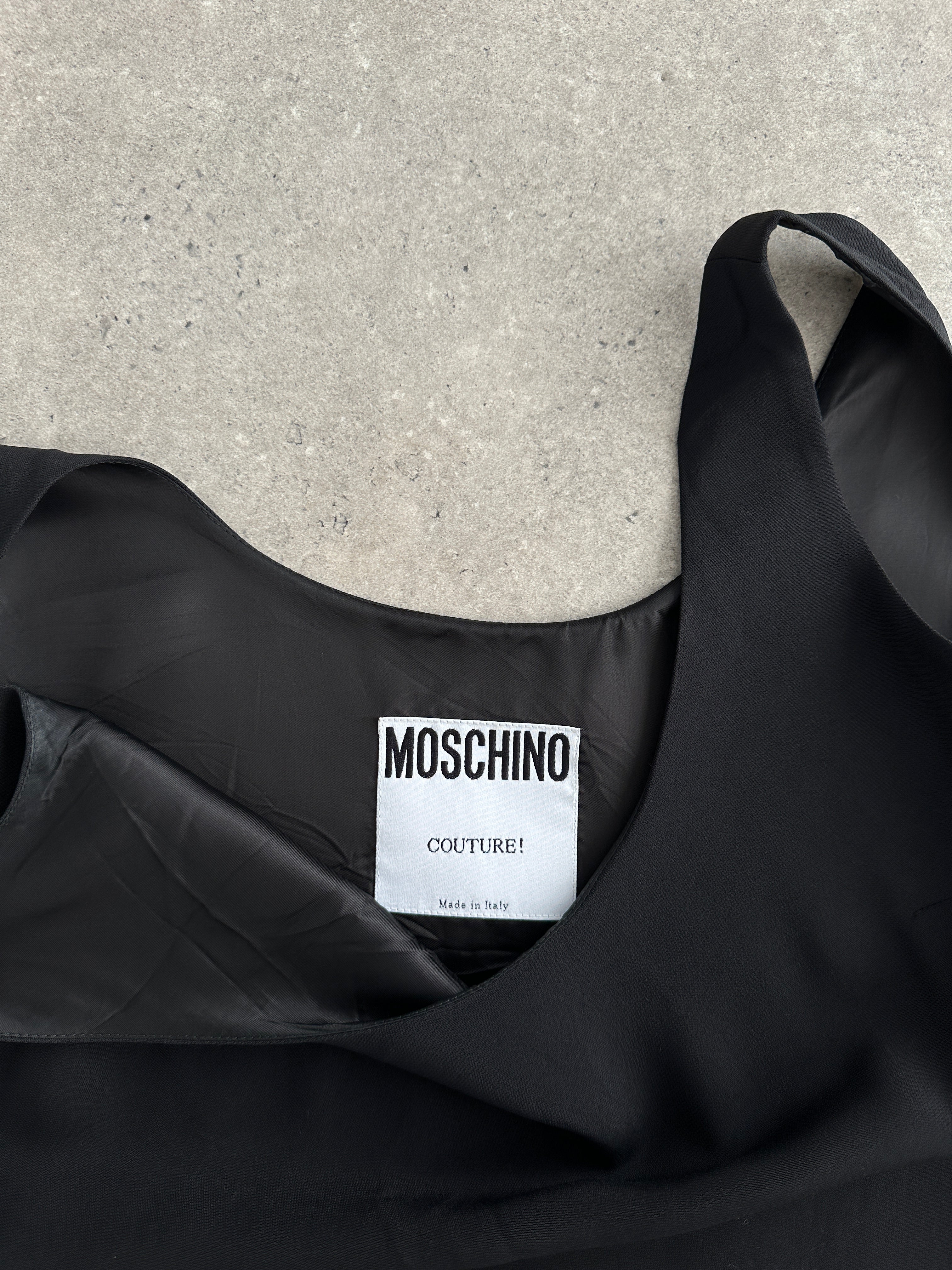 Moschino Couture fitted mini dress in size M, featuring bold design and stylish silhouette perfect for fashionable occasions.