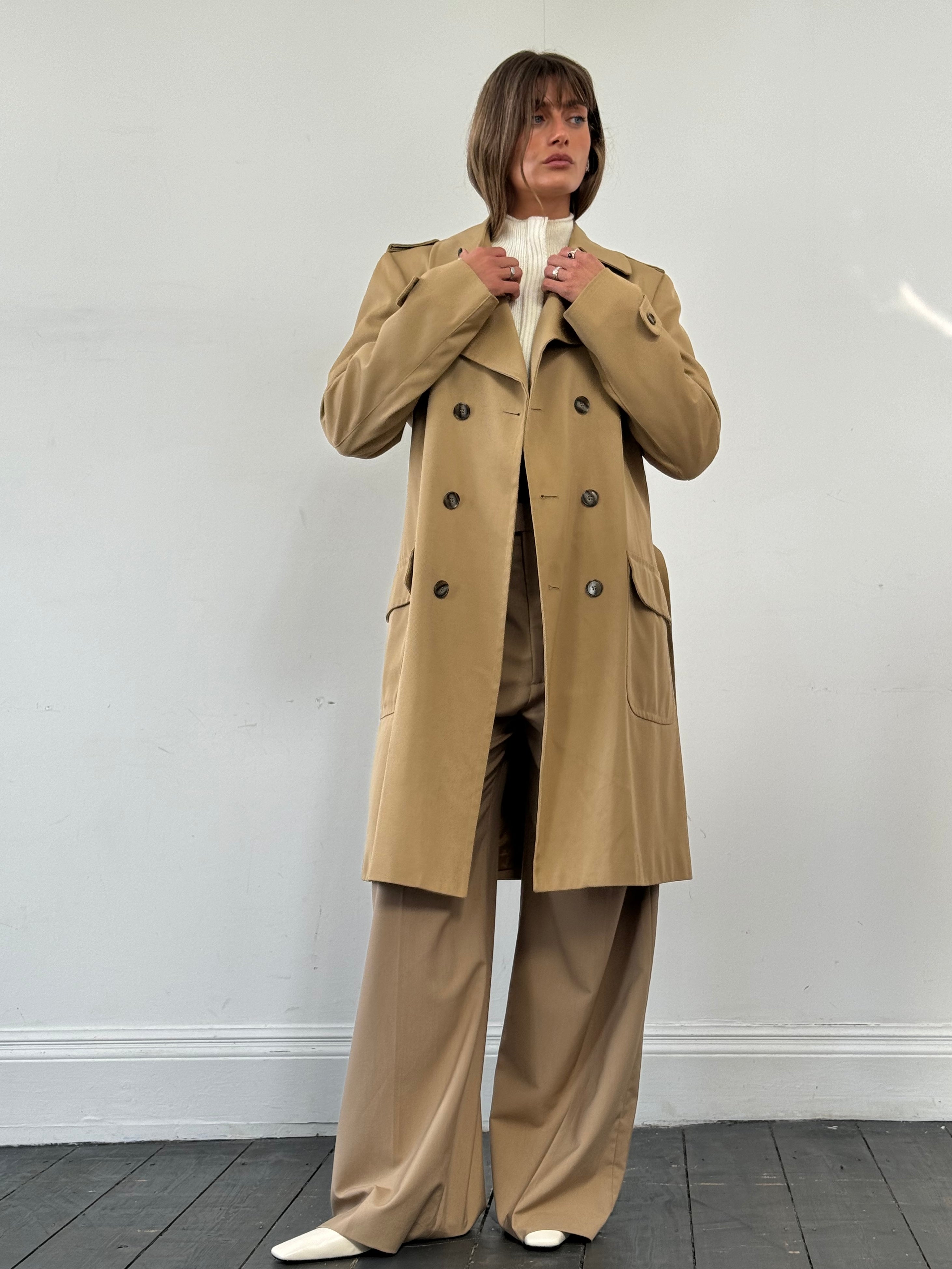 Vintage wool double-breasted trench coat in size L, featuring classic design and timeless style.