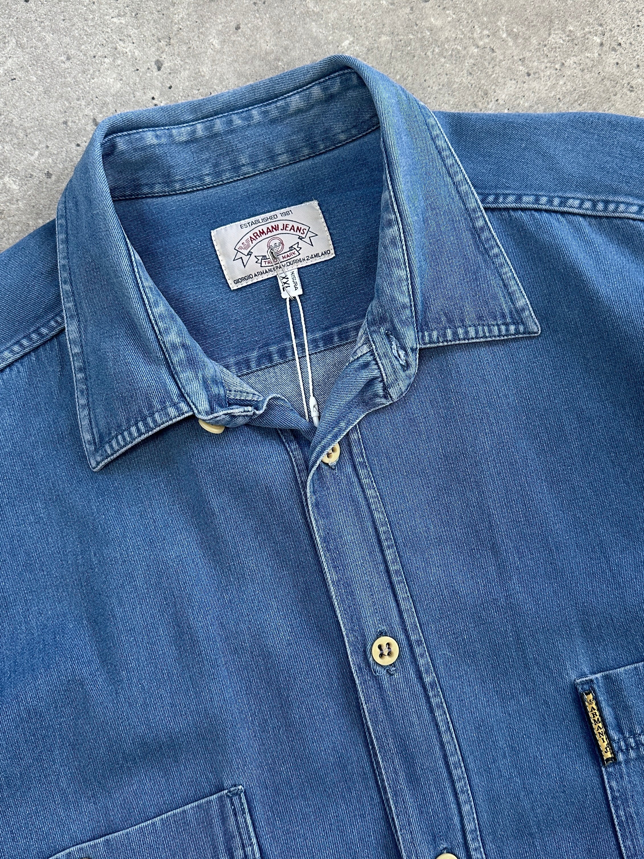 Armani Jeans pure cotton denim shirt in XL size, featuring classic blue denim fabric and button-up front, casual style.