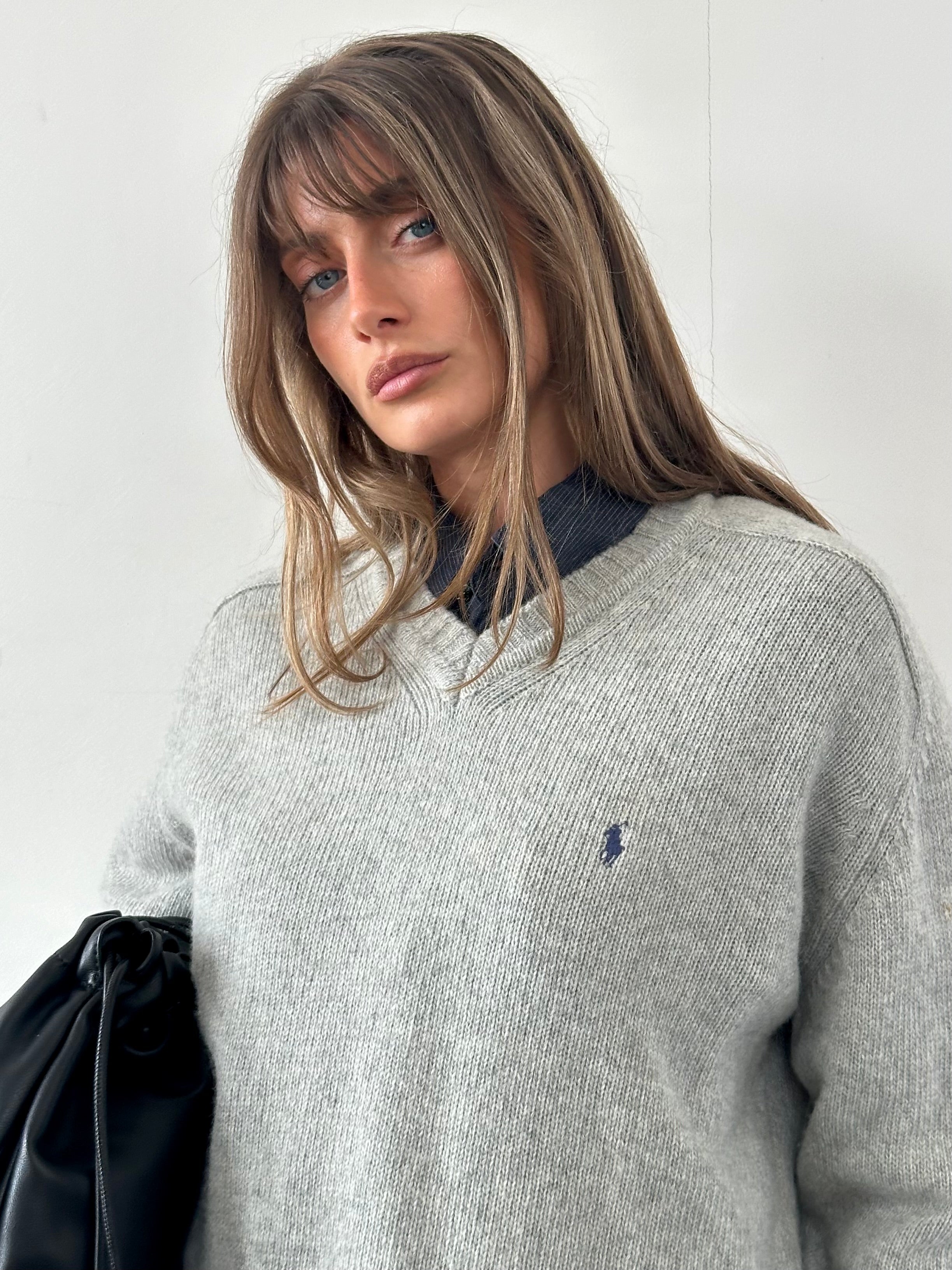 Ralph Lauren wool V-neck jumper in XL, featuring a classic fit, soft knit texture, and ribbed collar, shown on a neutral background.