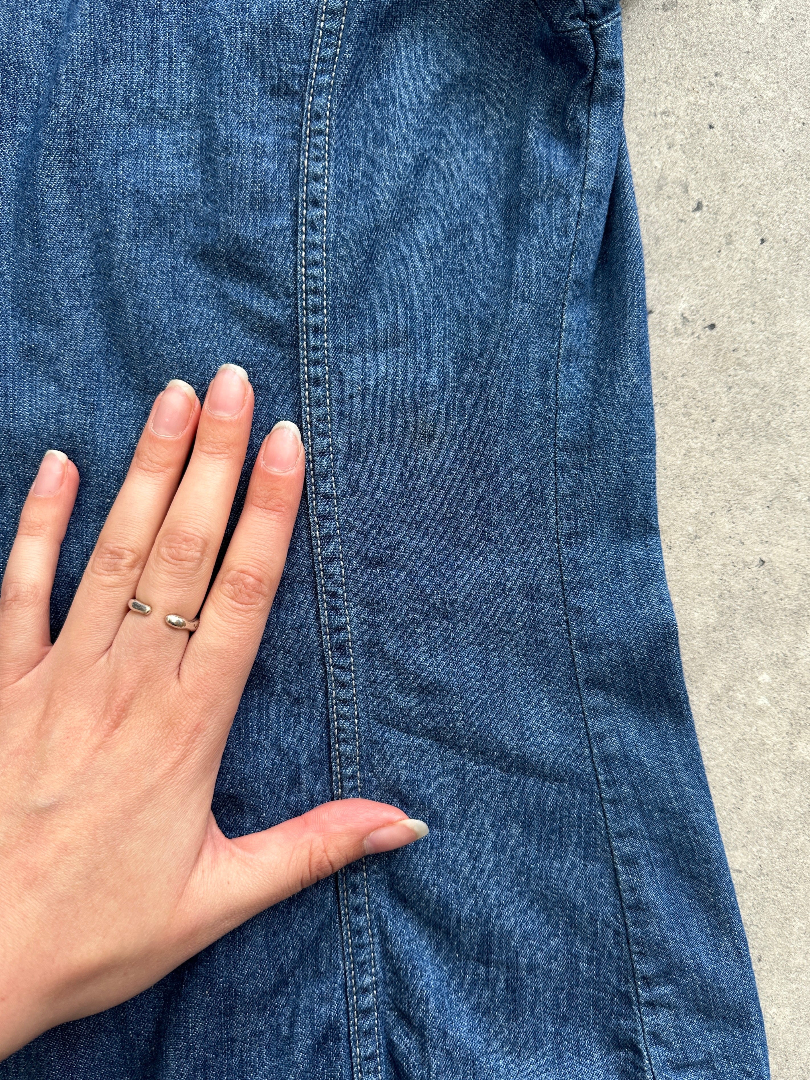 Diesel fitted denim shirt in size small, shown with collar, button front, and long sleeves, made of classic blue denim fabric.