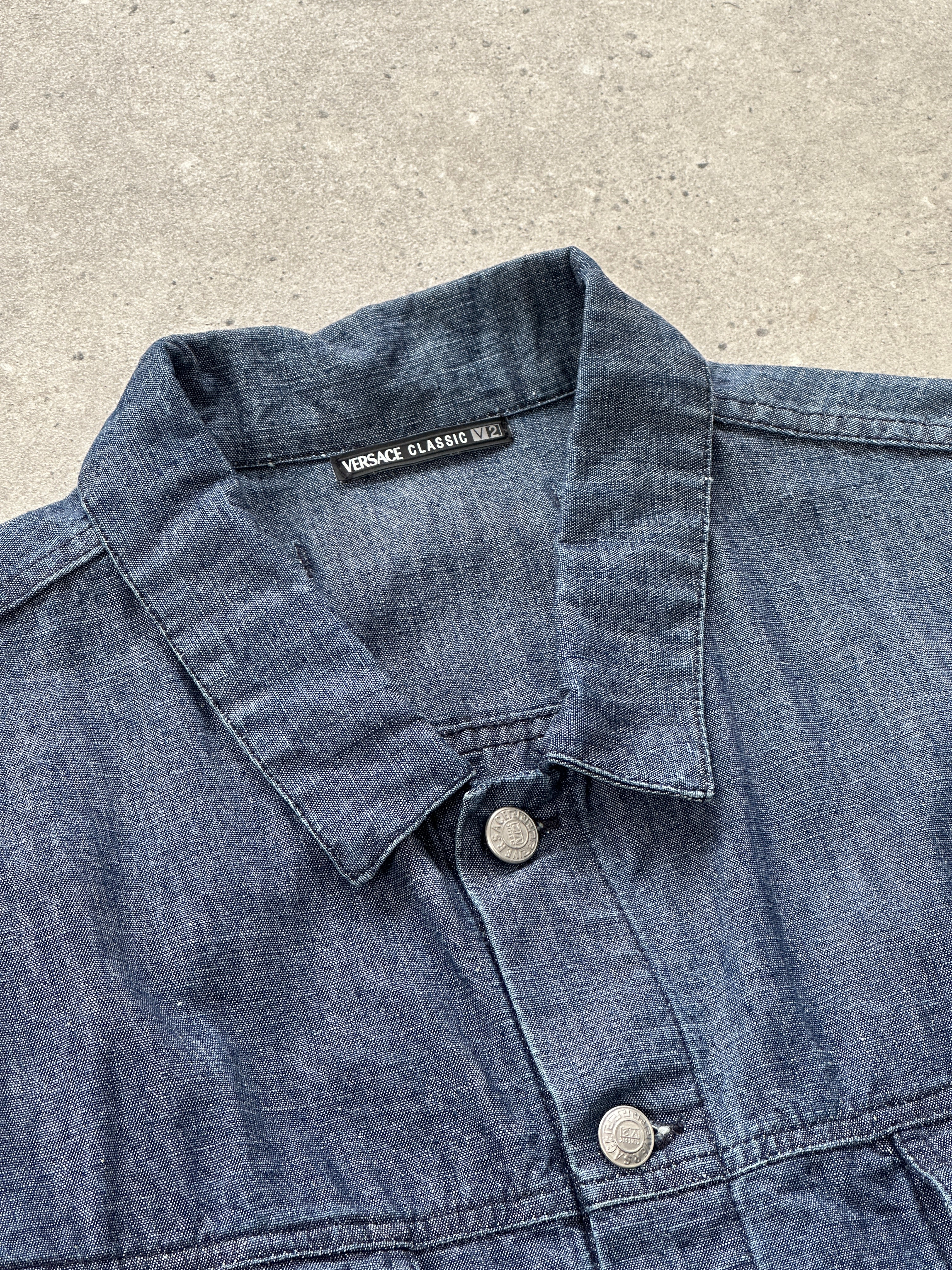 Versace Classic V2 90s bespoke button denim jacket in large/extra-large, featuring traditional denim styling and Versace branding.