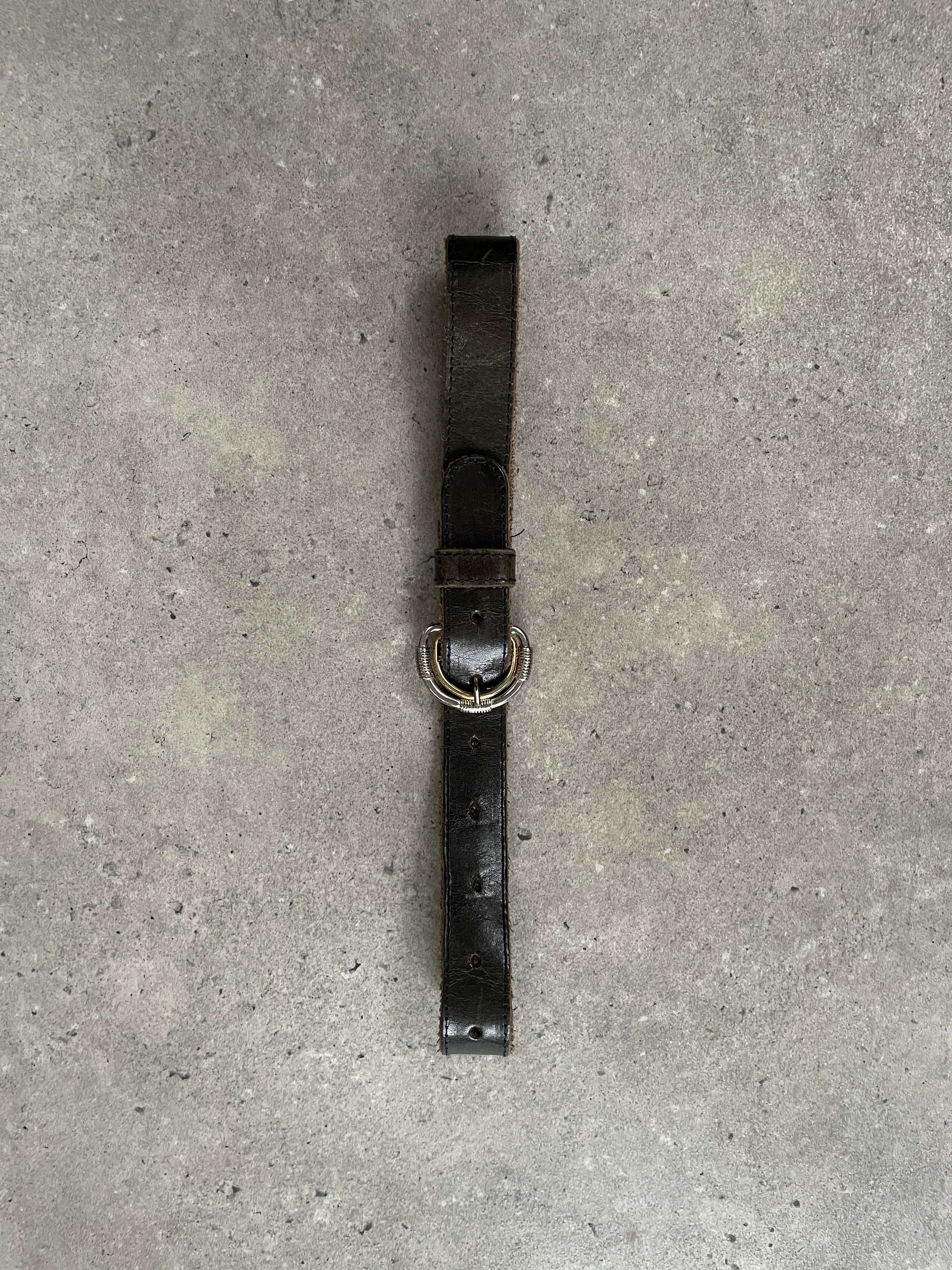 Vintage 1990s double buckle leather belt featuring classic design and adjustable fit, made by Vintage brand.