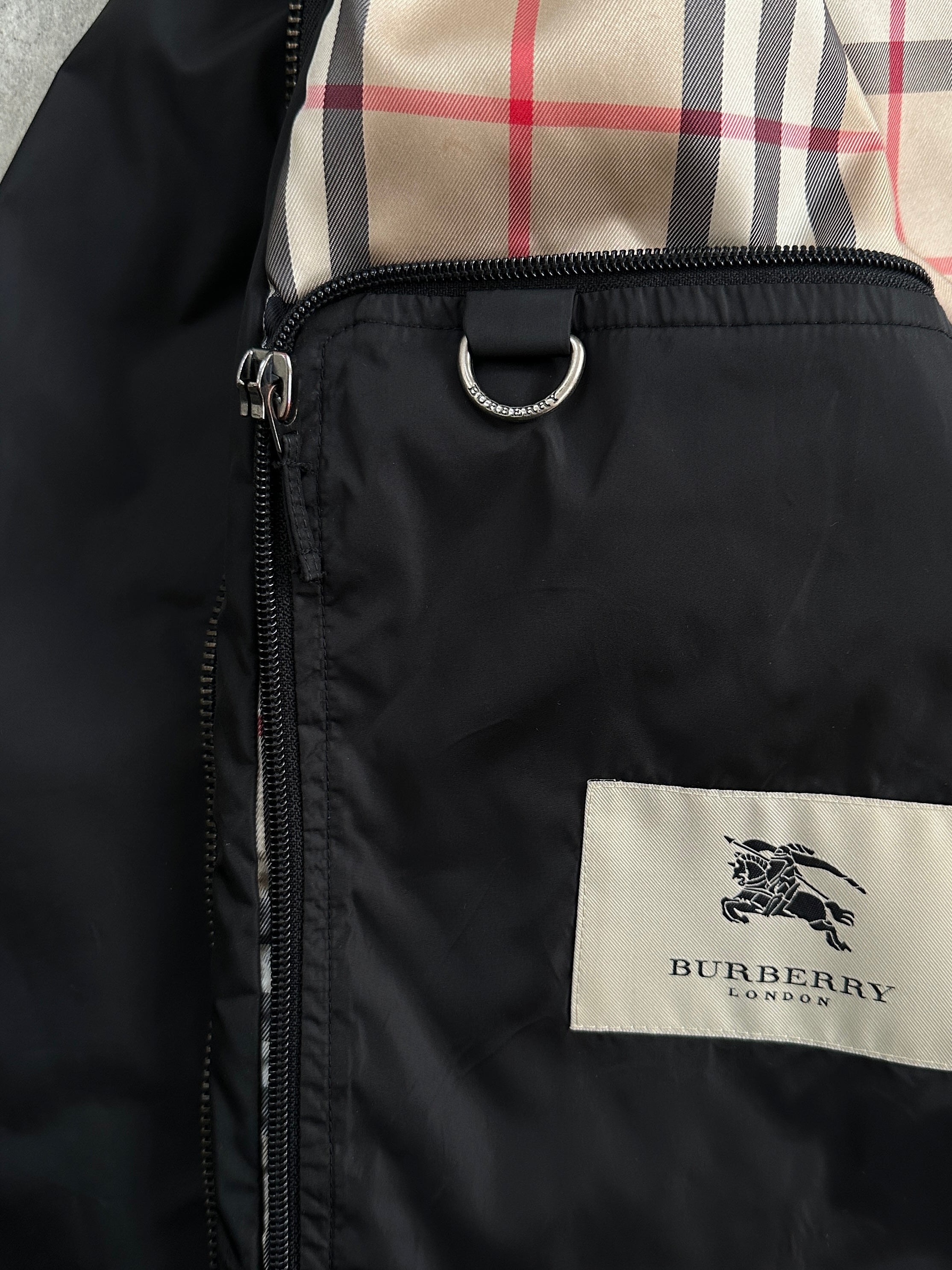 Burberry London 2000s nylon high neck jacket in black, featuring a high collar and sleek design, size large.