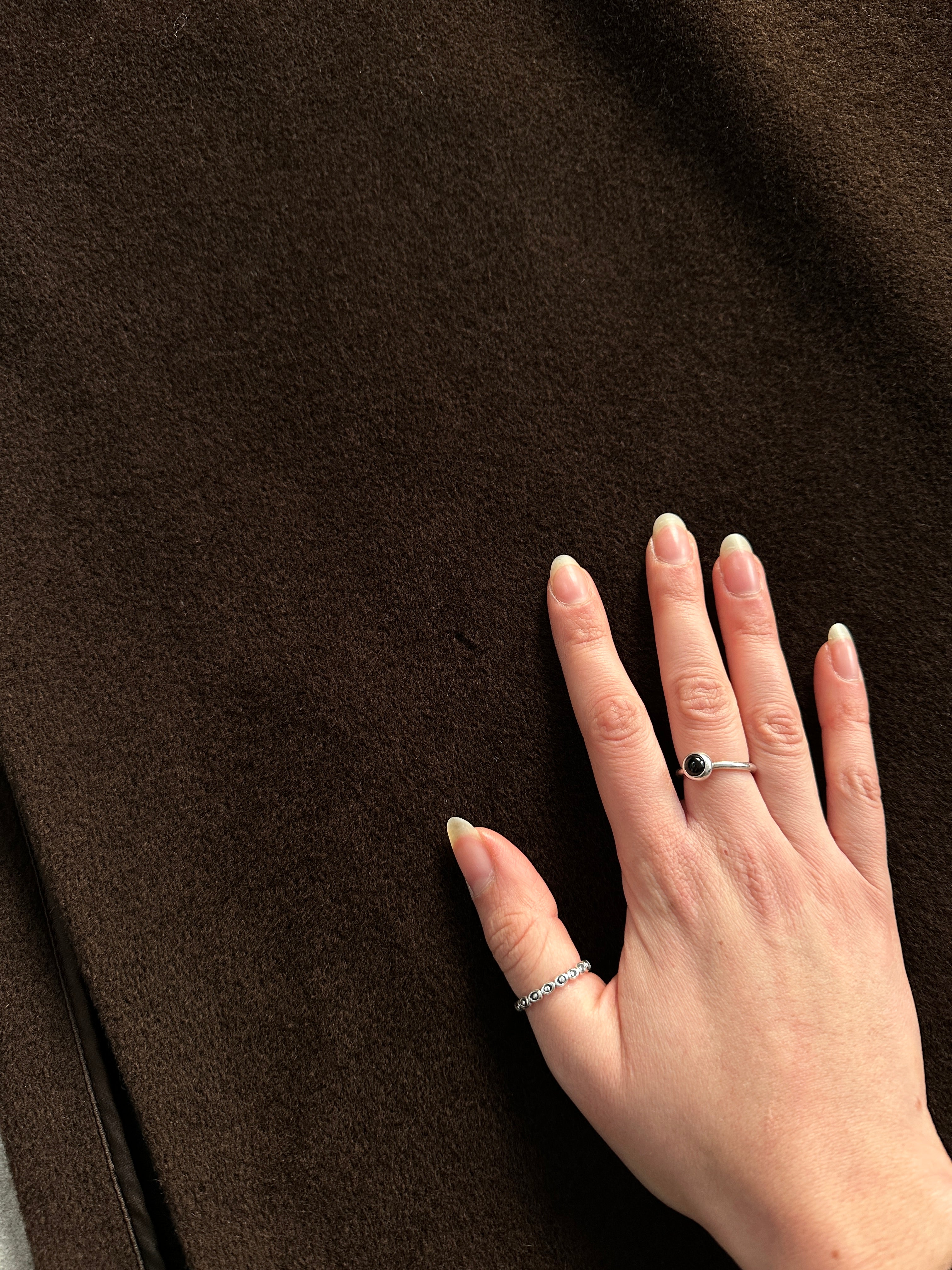 Max Mara wool cashmere double-breasted floor-length coat in size L, shown hanging with its elegant tailored design.