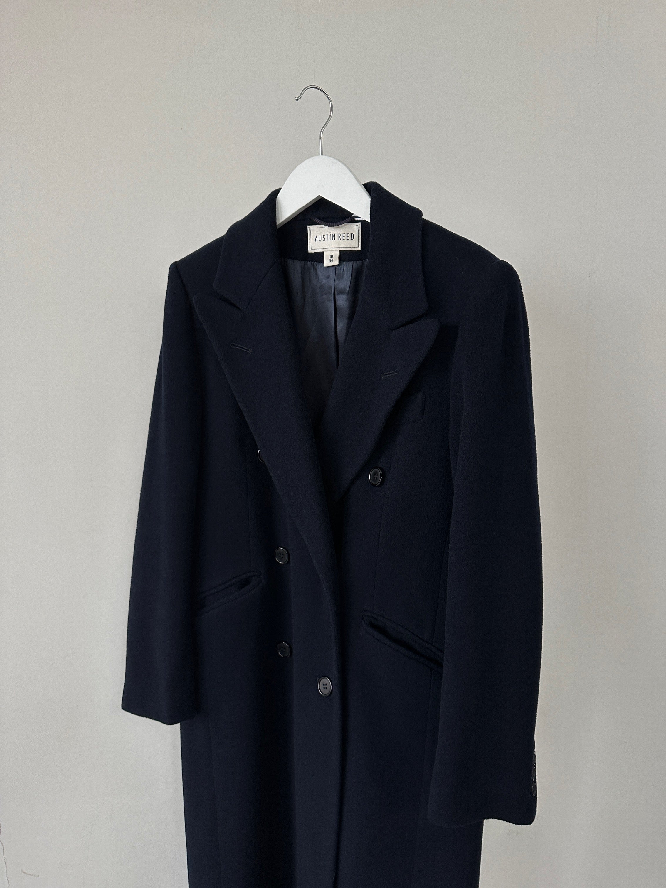Vintage wool cashmere double-breasted coat in size small, featuring classic design and tailored fit, shown on a hanger.