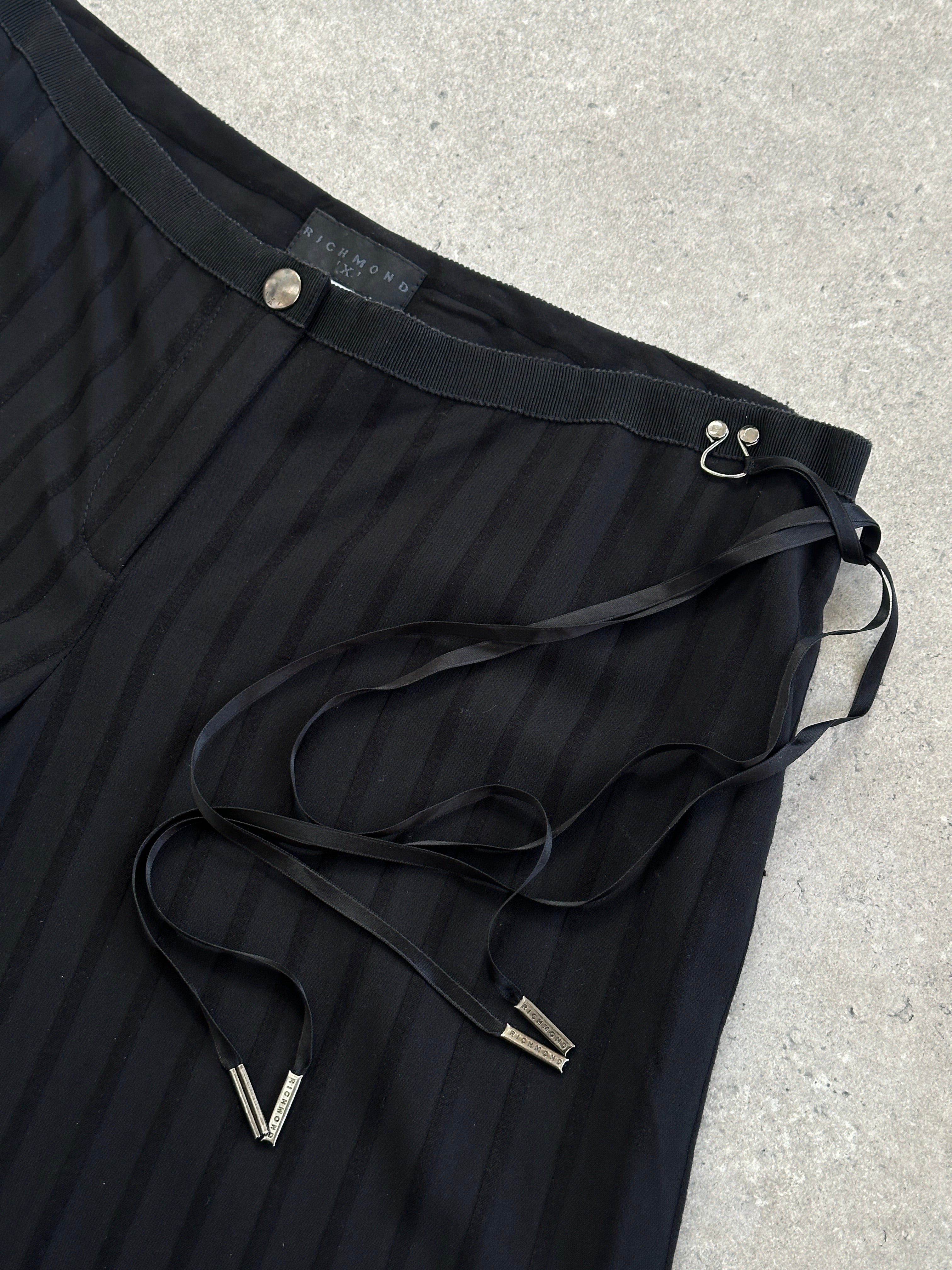 Richmond tie waist stripe wide leg trousers in navy and white, showing the fabric's flow and waistband detail.