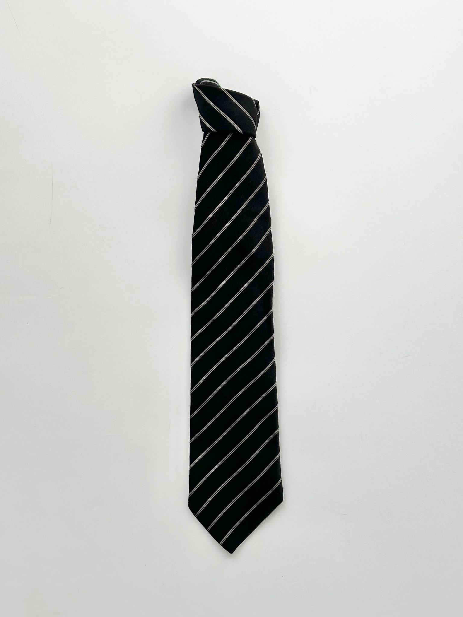 Giorgio Armani stripe silk wool tie featuring elegant diagonal pattern in blue and gray tones, displayed flat on a white background.