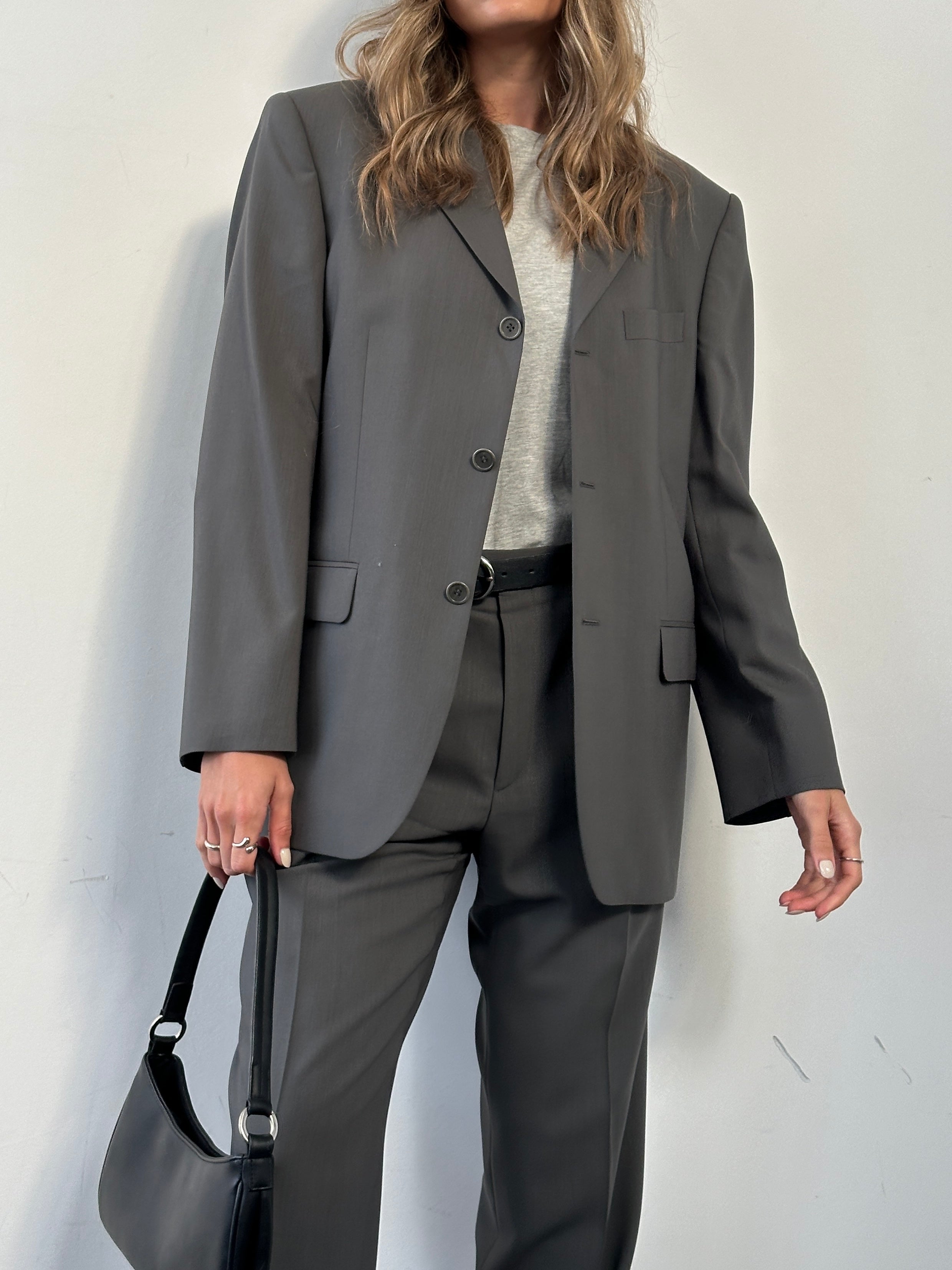 Balmain pure wool single-breasted suit jumpsuit in size 38S/W32, tailored fit with classic lapel and front button closure.