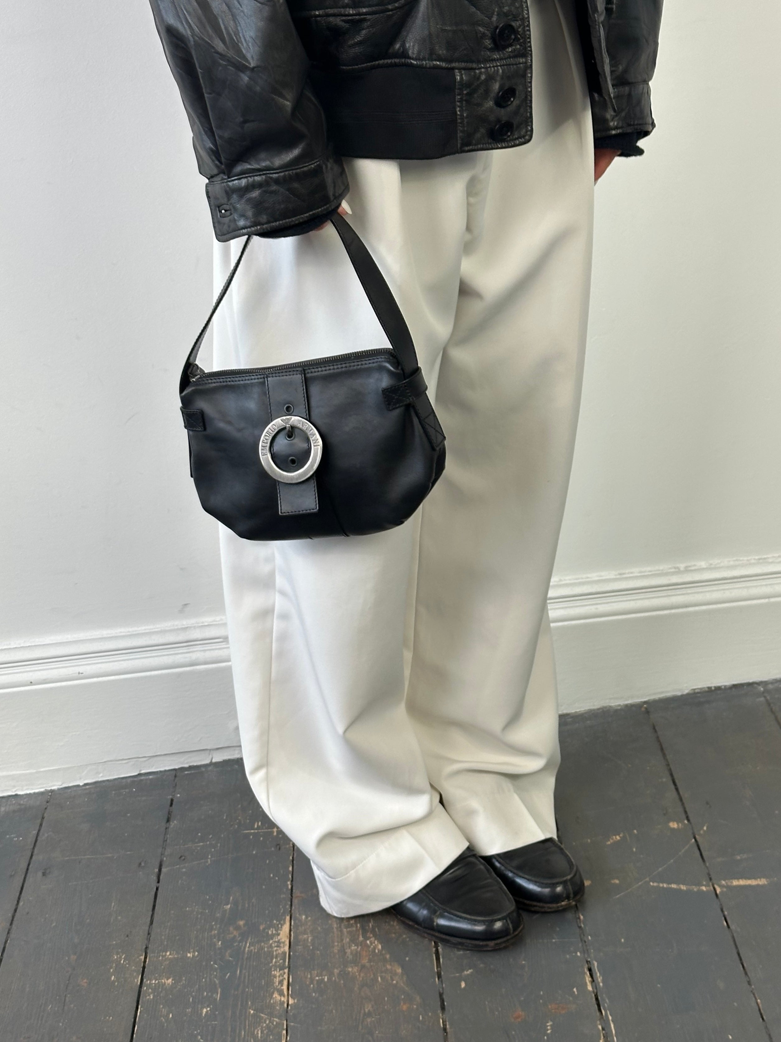 Emporio Armani leather shoulder bag from the 2000s with sleek design and adjustable strap, made of smooth black leather.