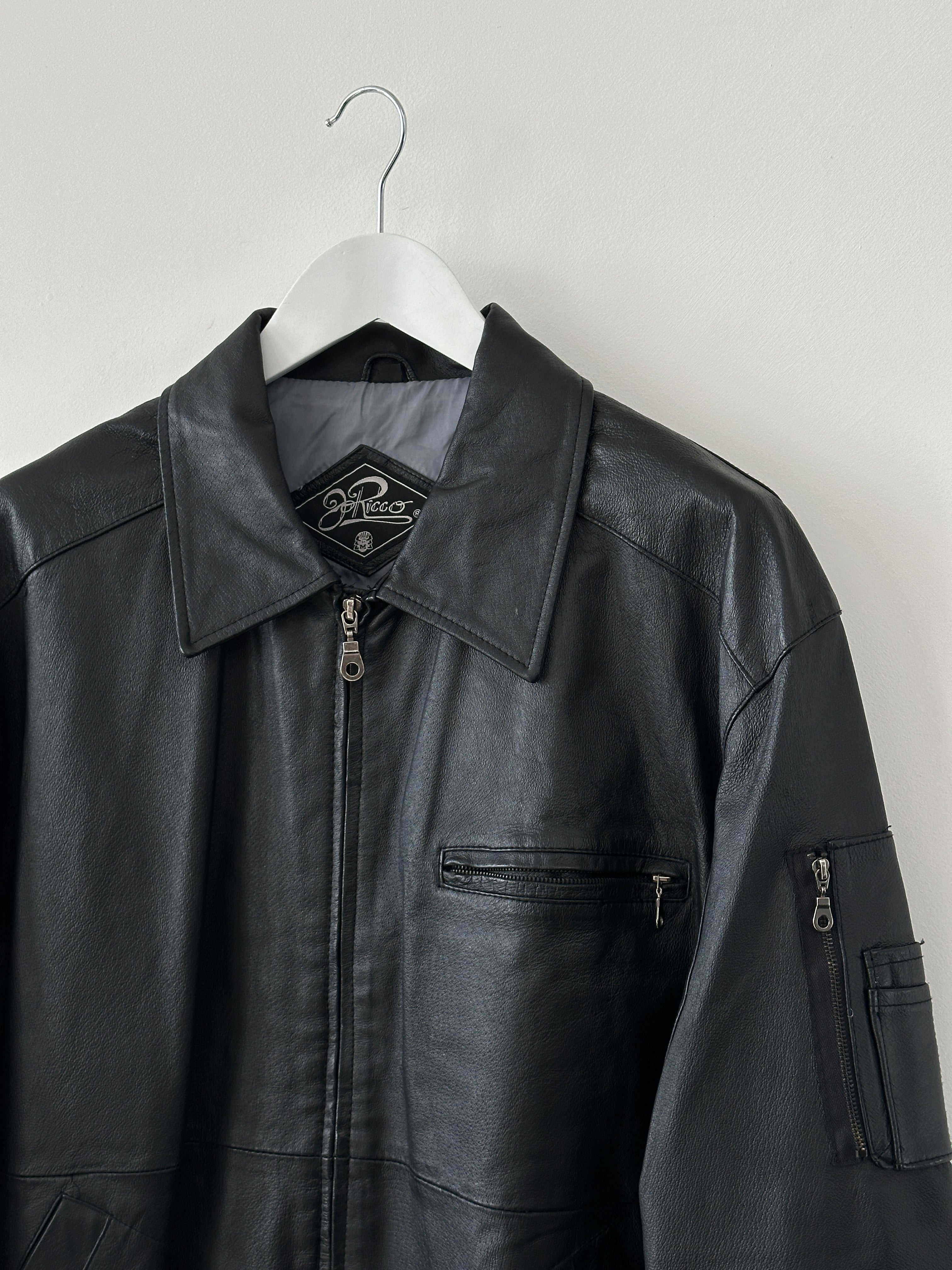 Vintage leather bomber jacket in XL size, featuring classic design with ribbed cuffs and collar, made by Vintage brand.