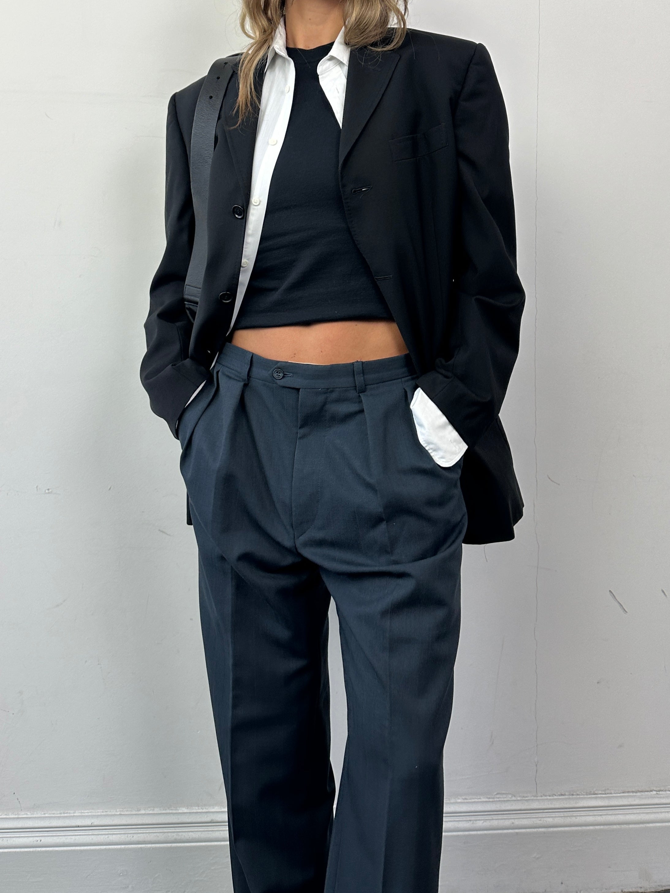 Dolce & Gabbana single-breasted virgin wool blazer in size M, tailored fit, classic lapels, and button closure.