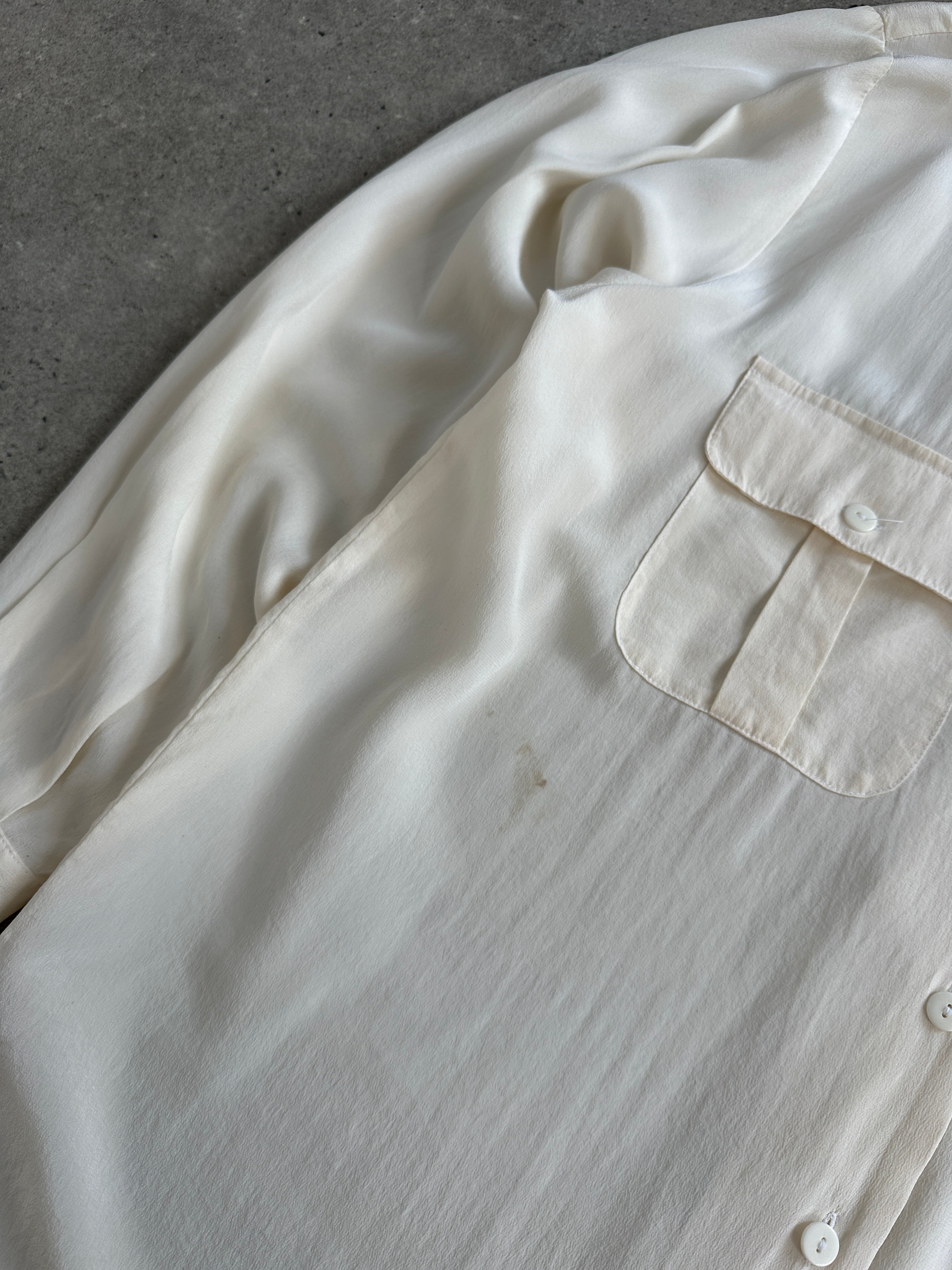 Vintage 1990s pure silk minimal shirt in size M, featuring a classic design and smooth fabric, displayed on a hanger.