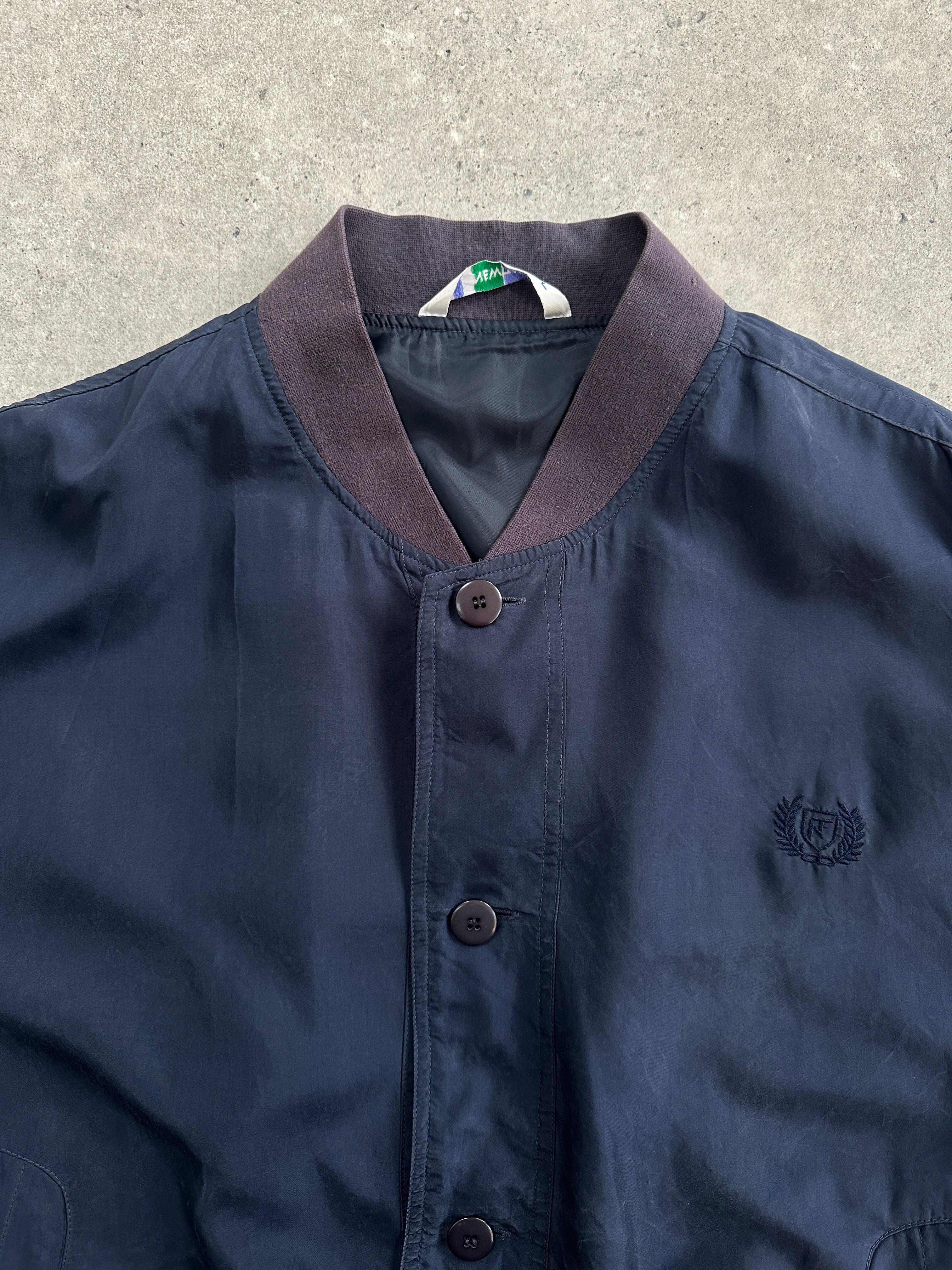 Vintage 1990s pure silk bomber jacket in size L, featuring classic design and smooth silk fabric.