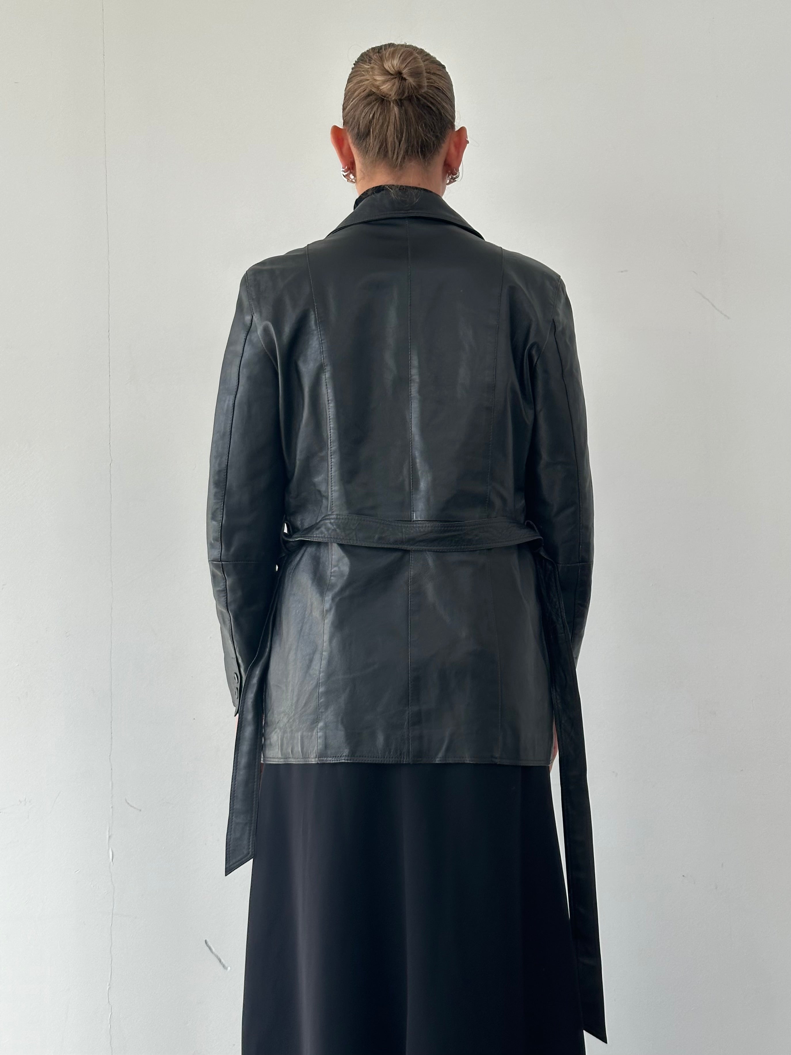 Conbipel belted leather jacket in medium size, featuring a stylish design with a belt and classic leather texture.