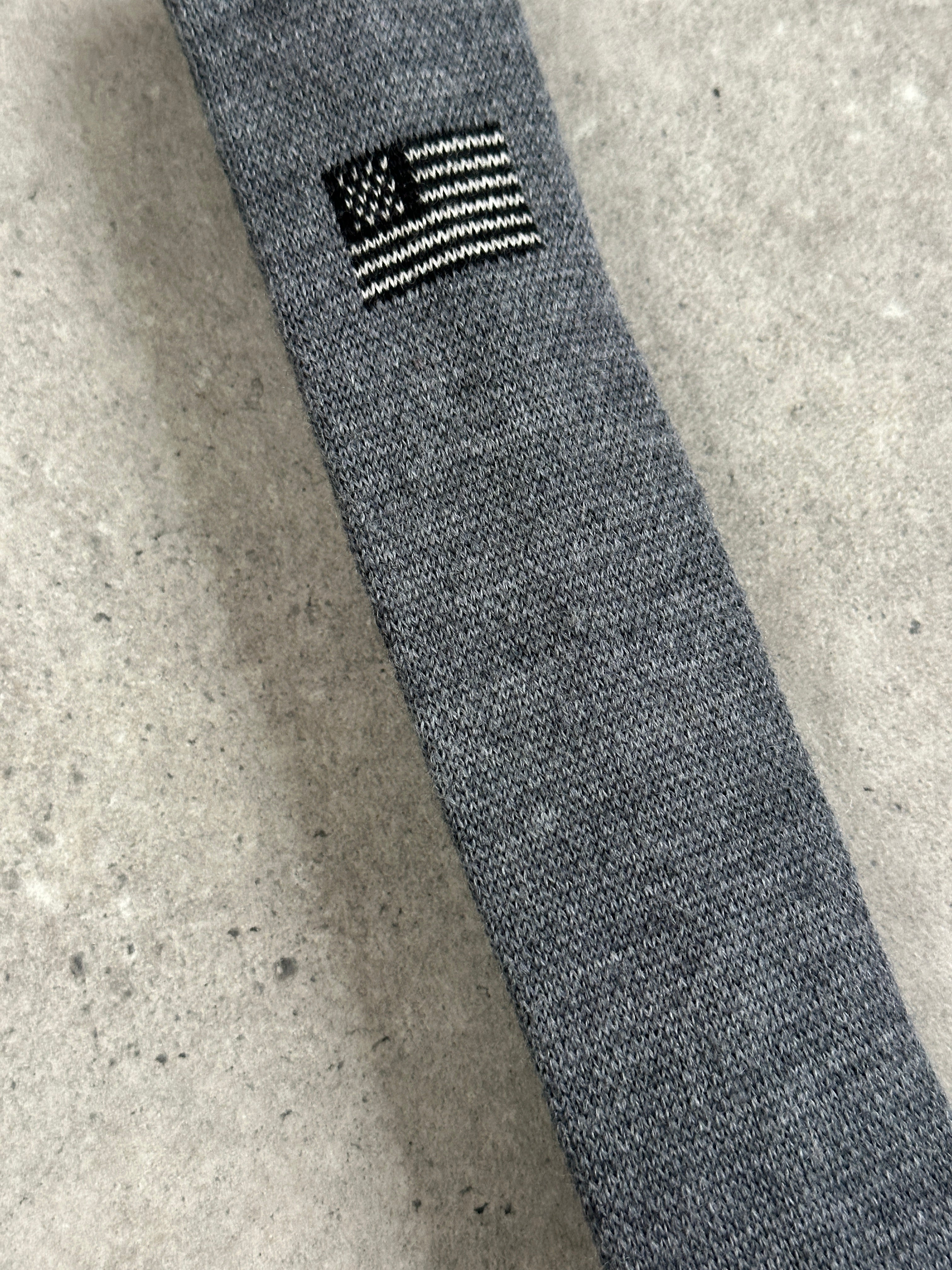 Vintage Japanese 1990s pure wool knitted flag tie with intricate design and vibrant colors, showcasing classic craftsmanship.