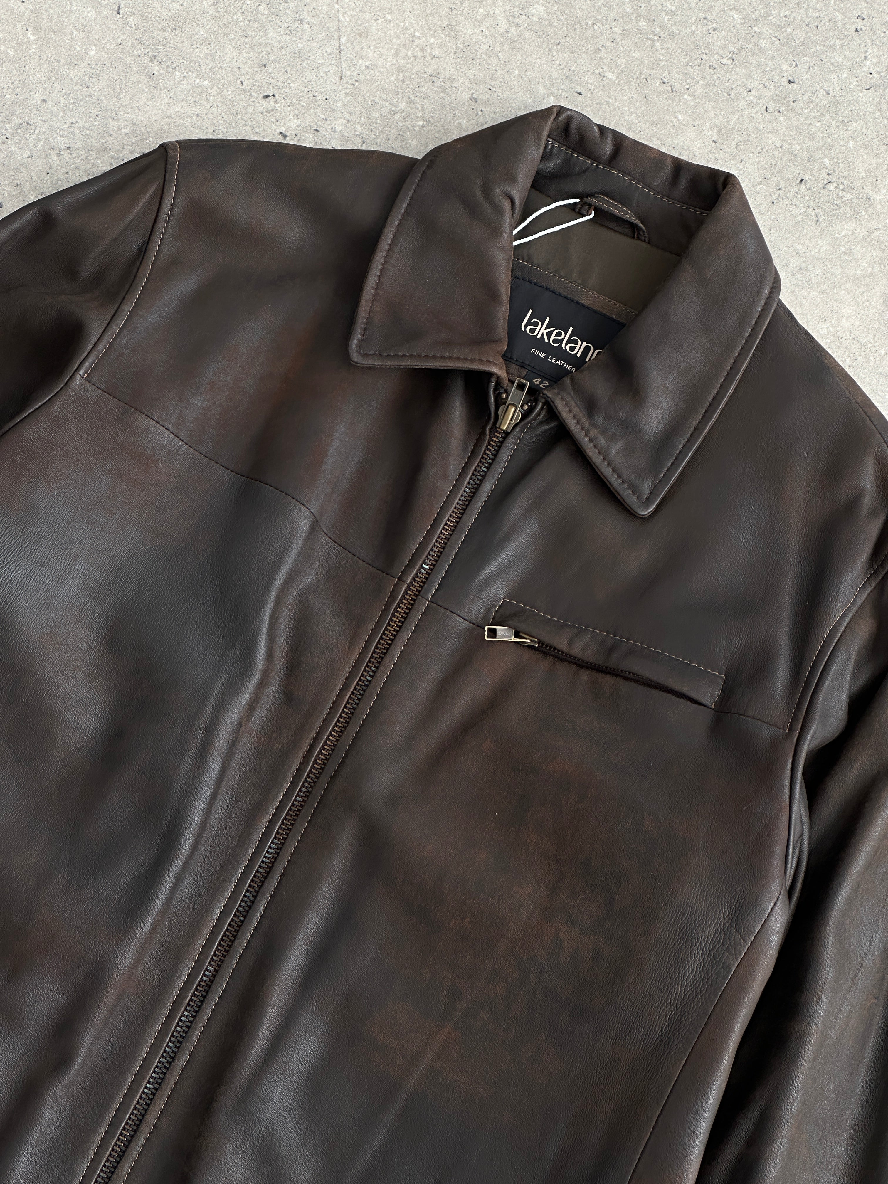 Vintage aged leather jacket in size XL, featuring a rugged, classic design with visible wear and a timeless style.