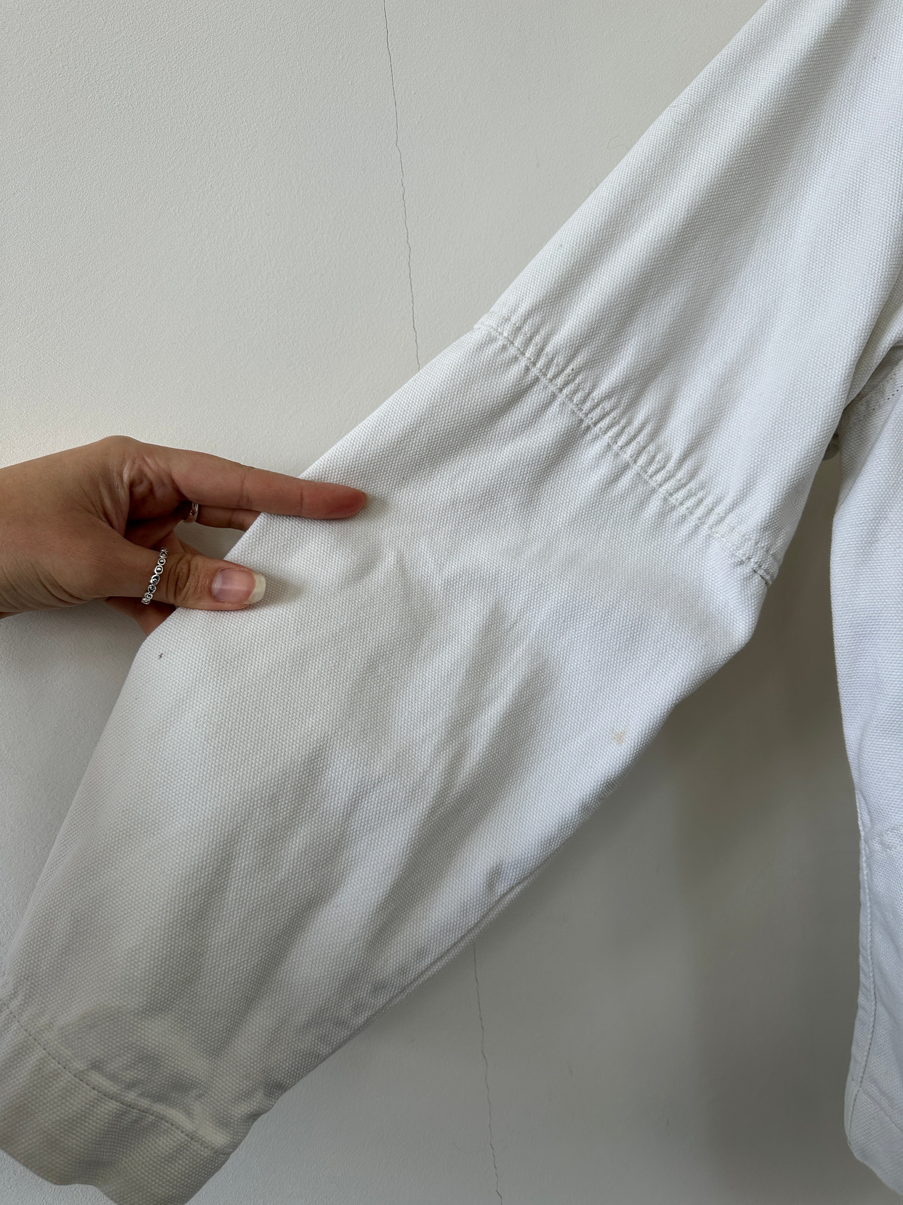 Levi’s cotton zip-up bomber jacket in size L, shown in a close-up image highlighting the front zipper and fabric texture.