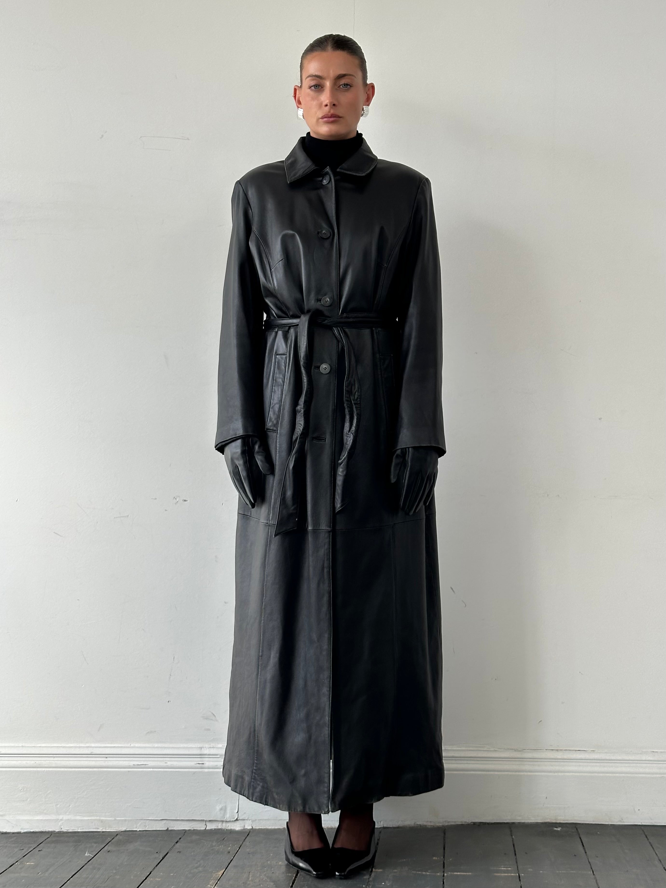 Elegant vintage leather trench coat with belt, floor-length, in XL size, showcasing classic design and rich leather texture.
