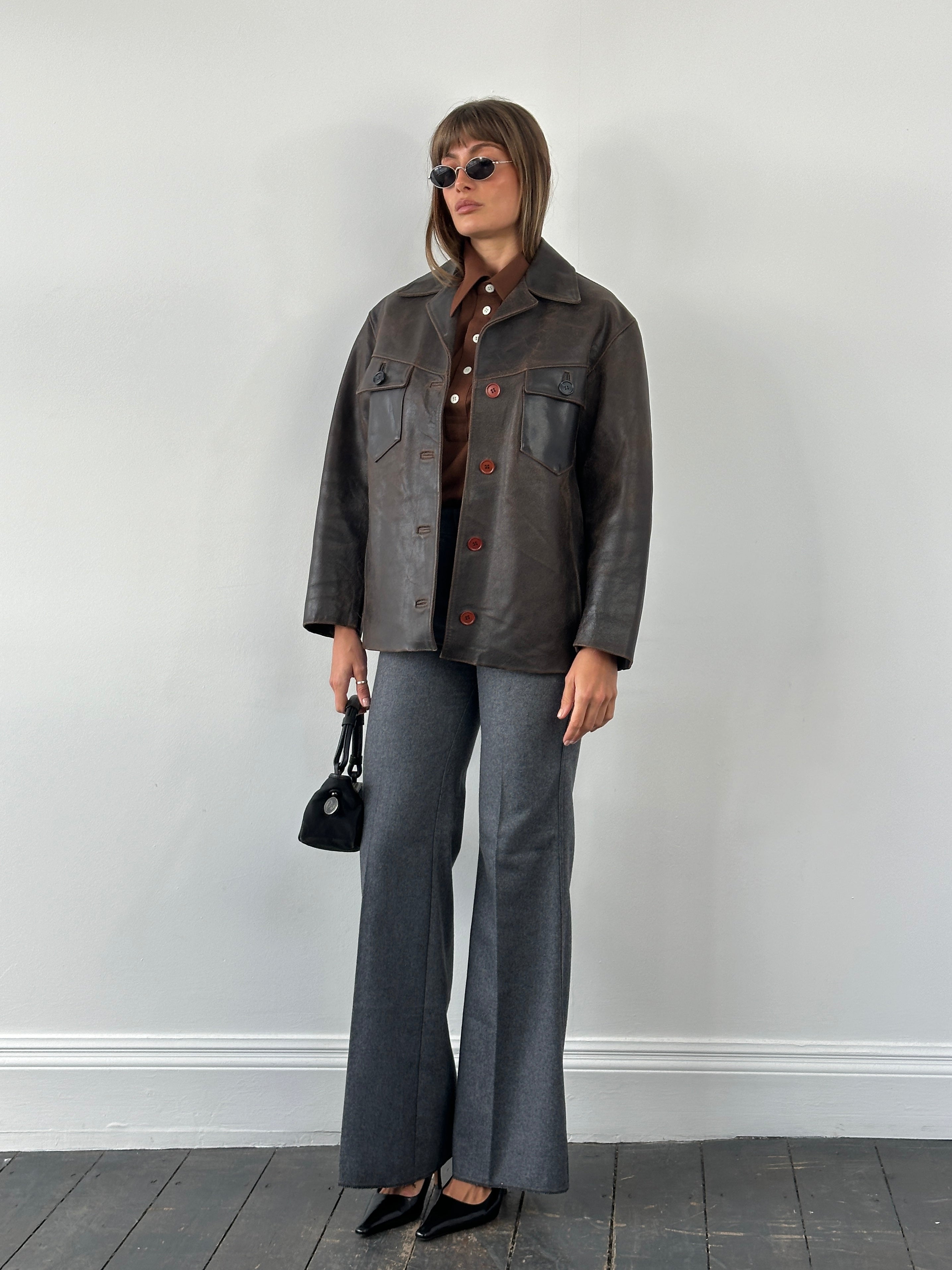 Conbipel 1970s Italian aged leather jacket in size M/L, featuring classic vintage style and detailed craftsmanship.