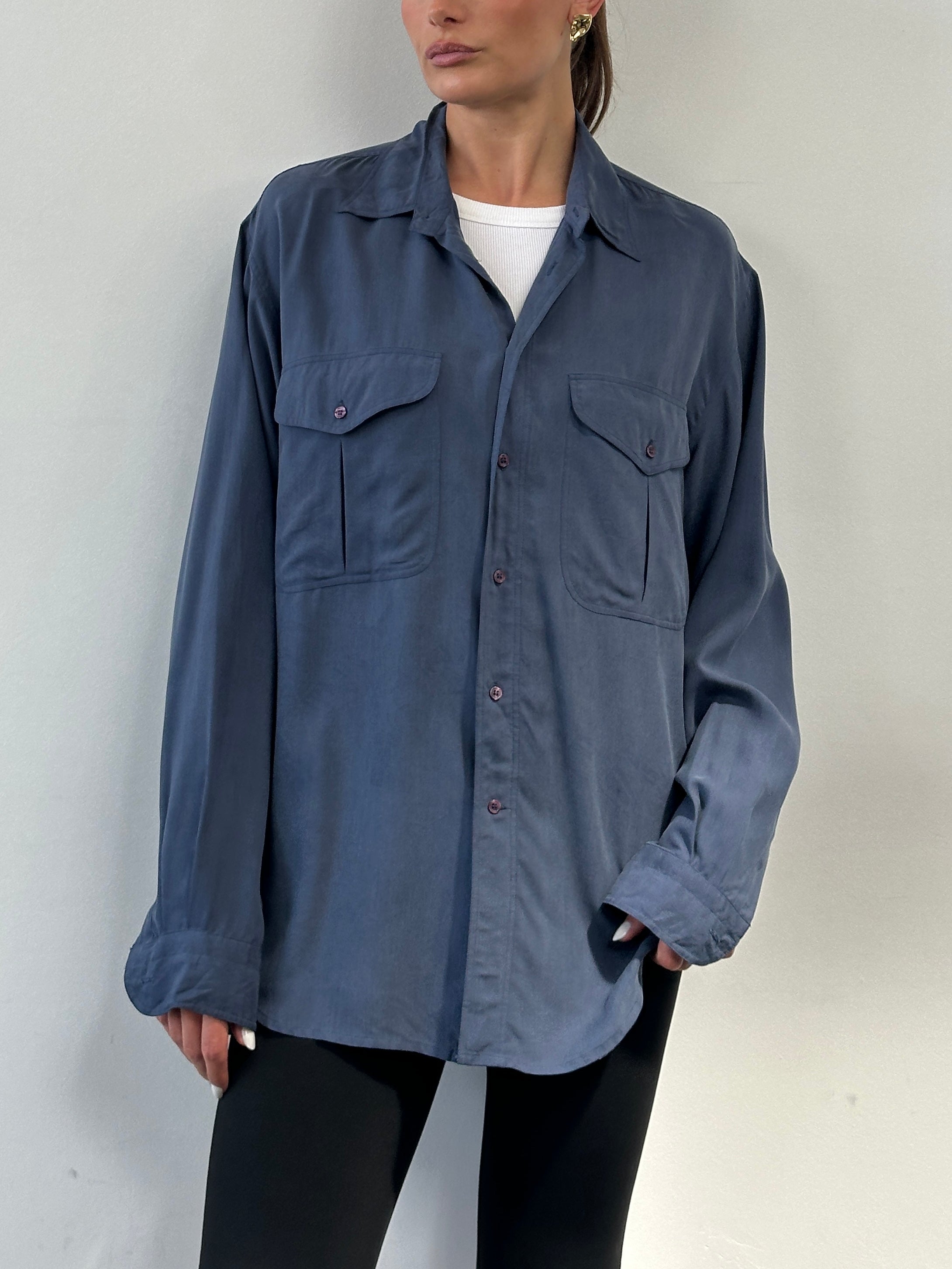 Vintage pure silk shirt in XL size, featuring a classic design with smooth fabric and button-down front, displayed on a hanger.