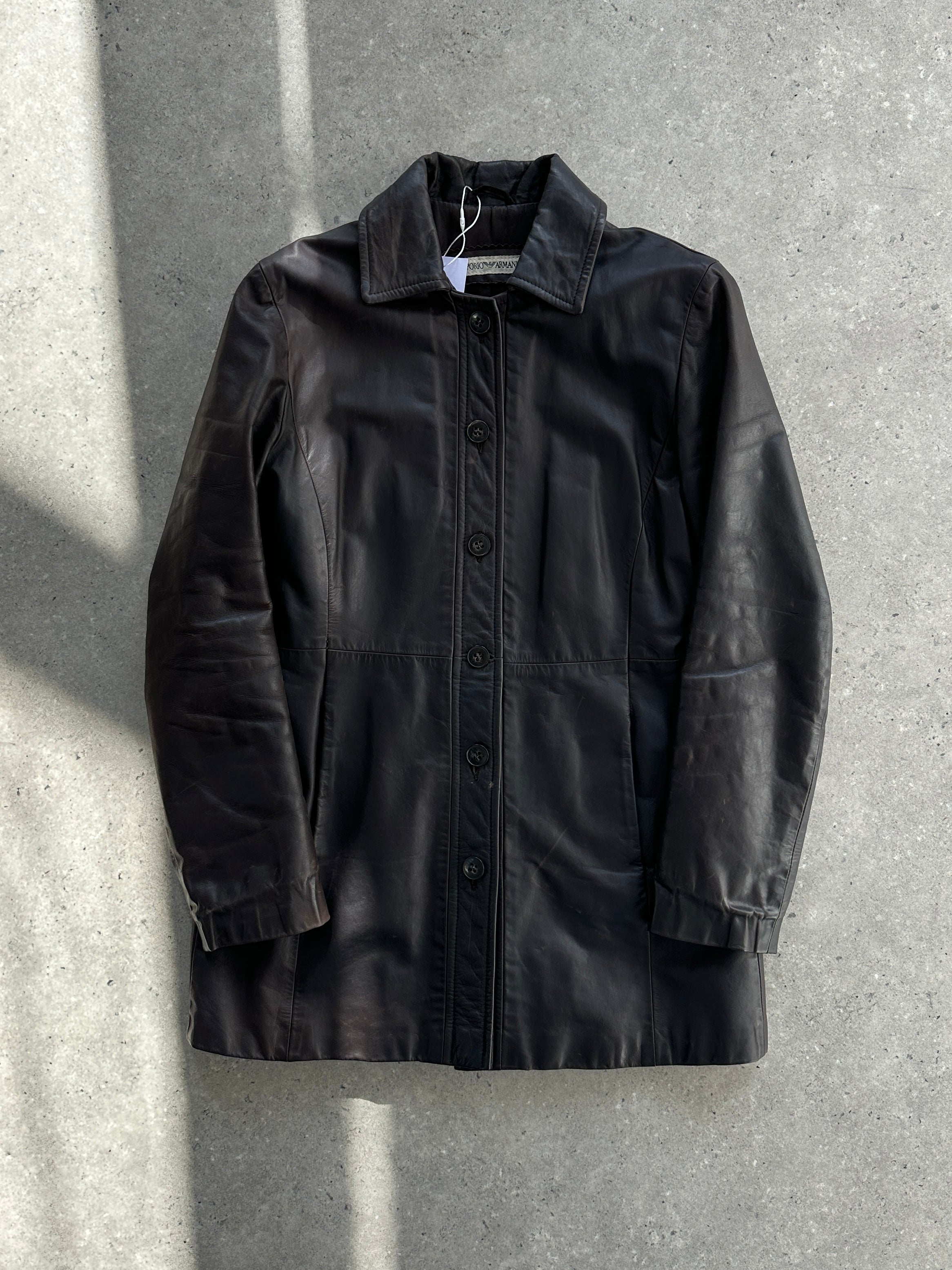 Emporio Armani leather jacket in size S, black, with sleek design and classic collar, shown on a hanger.