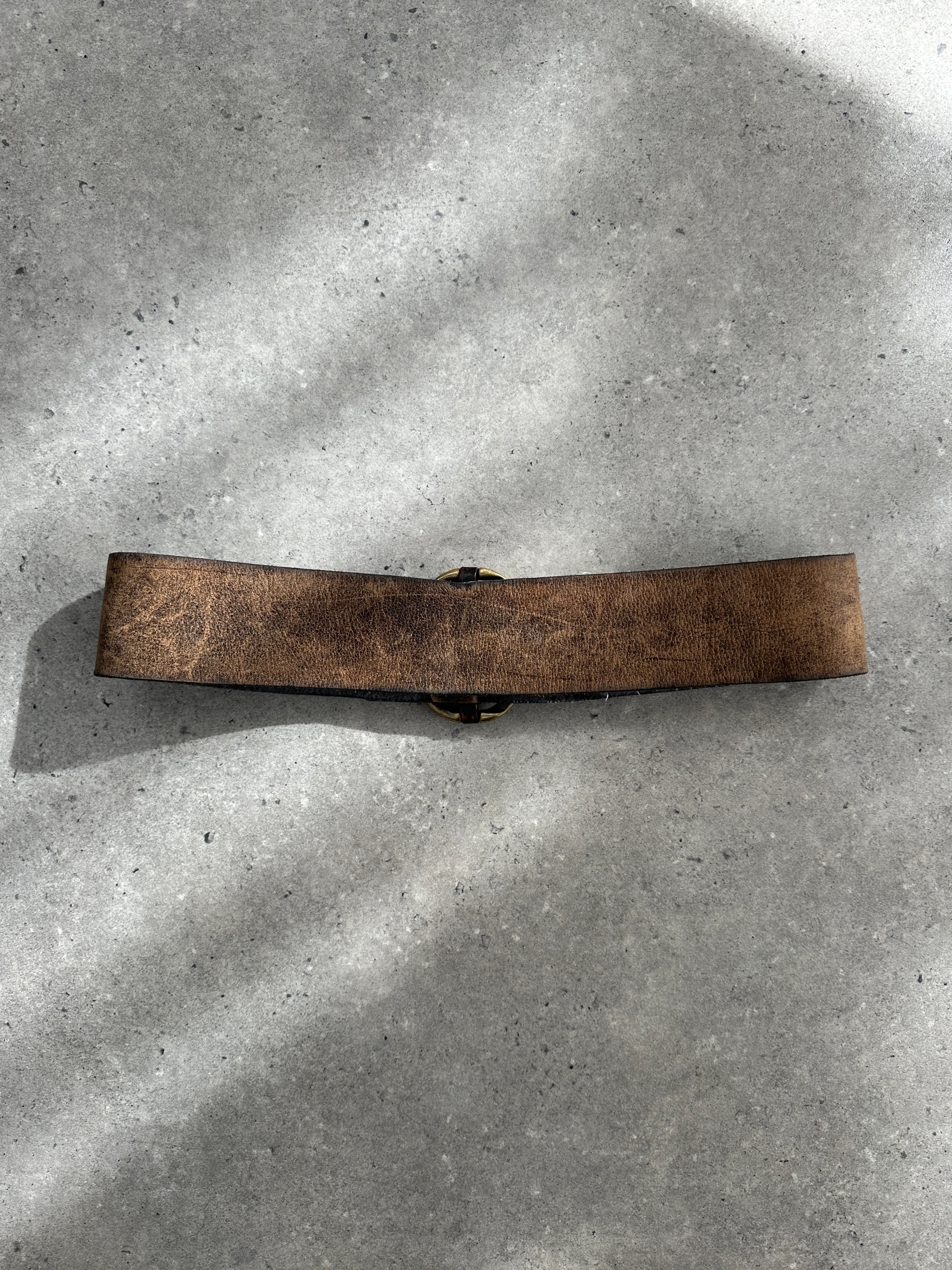 Vintage 1980s chunky leather belt with aged brown finish, size W31-35, featuring classic vintage style and textured leather surface.