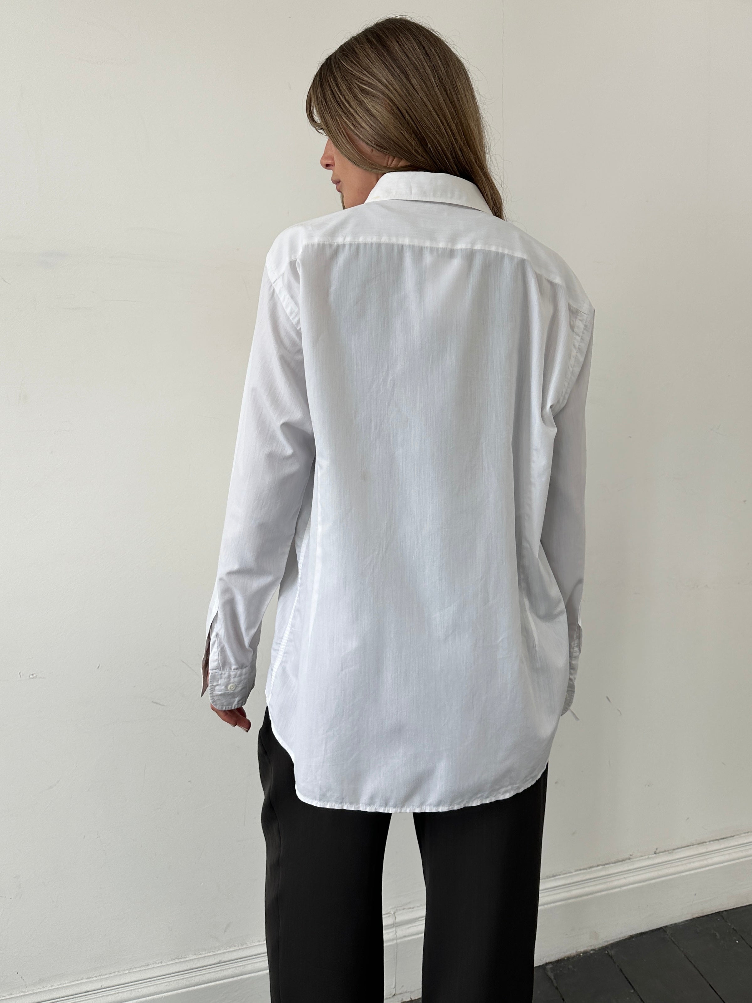 Christian Dior cotton logo shirt in size large, featuring a classic design with the iconic Christian Dior branding on the front.