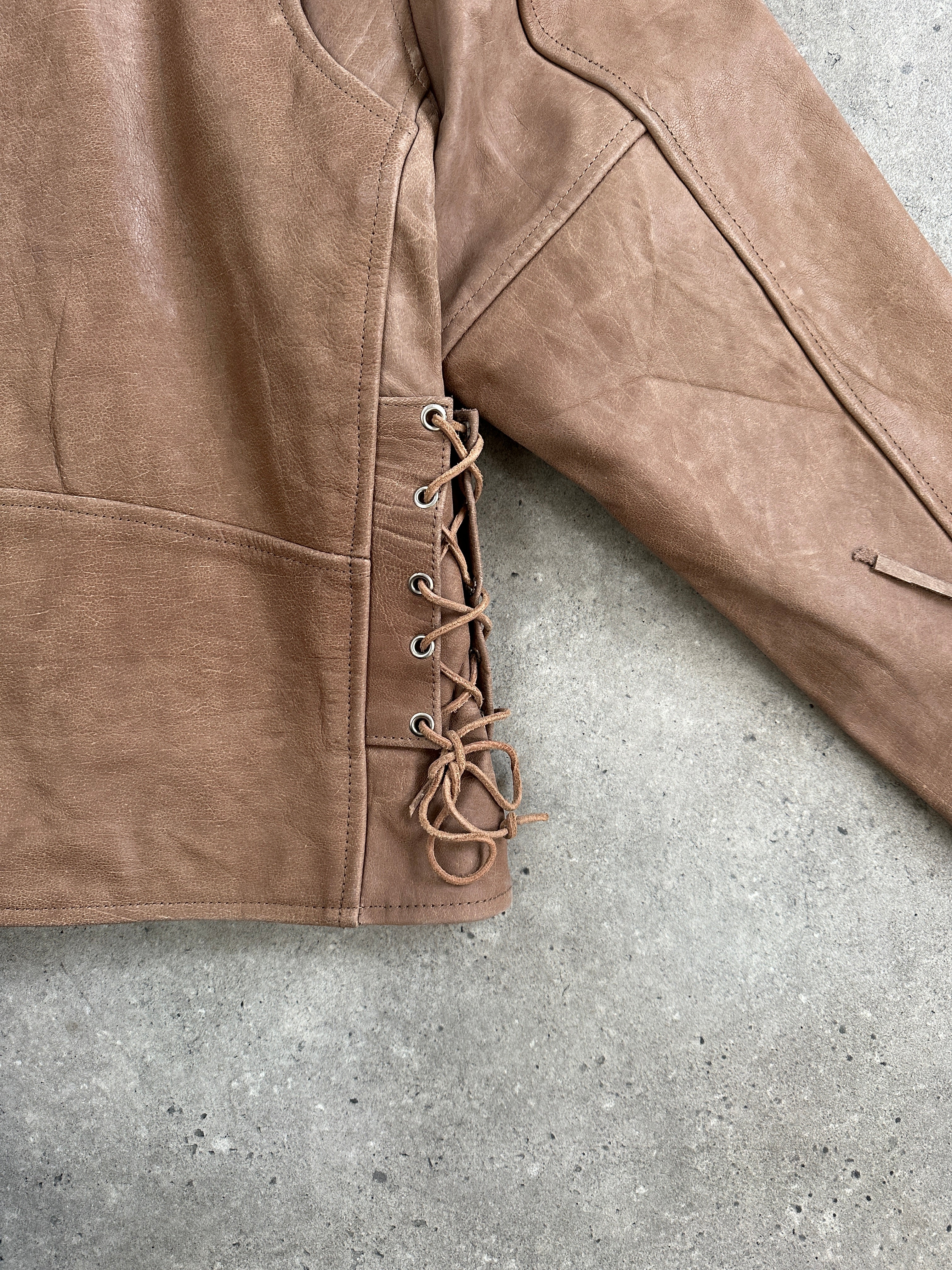 Vintage 1990s leather biker jacket in XL with classic design, black leather exterior, and metal zipper details.