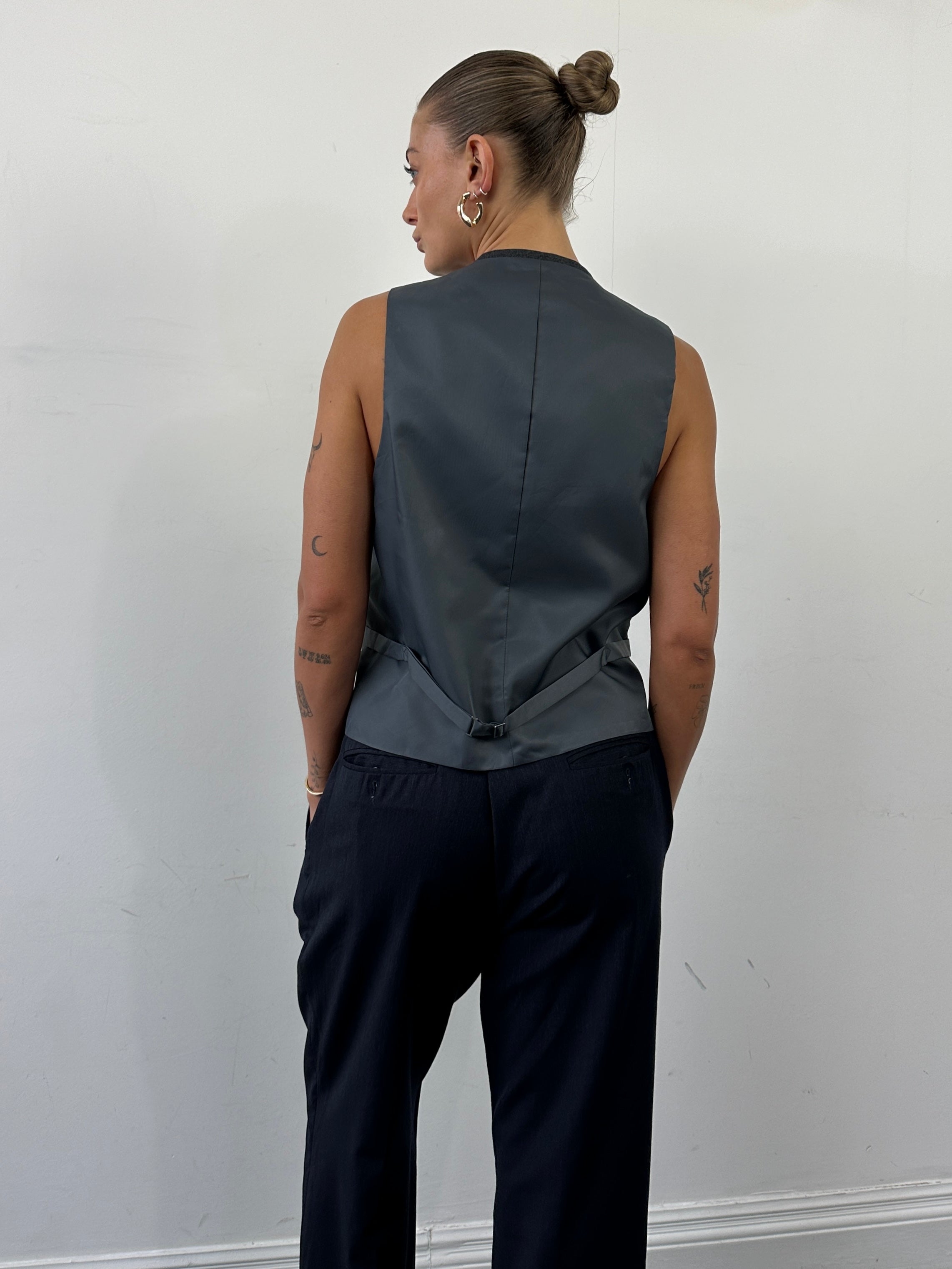 Vintage pure wool single-breasted tailored waistcoat in size L, shown on a hanger with detailed stitching and classic design.