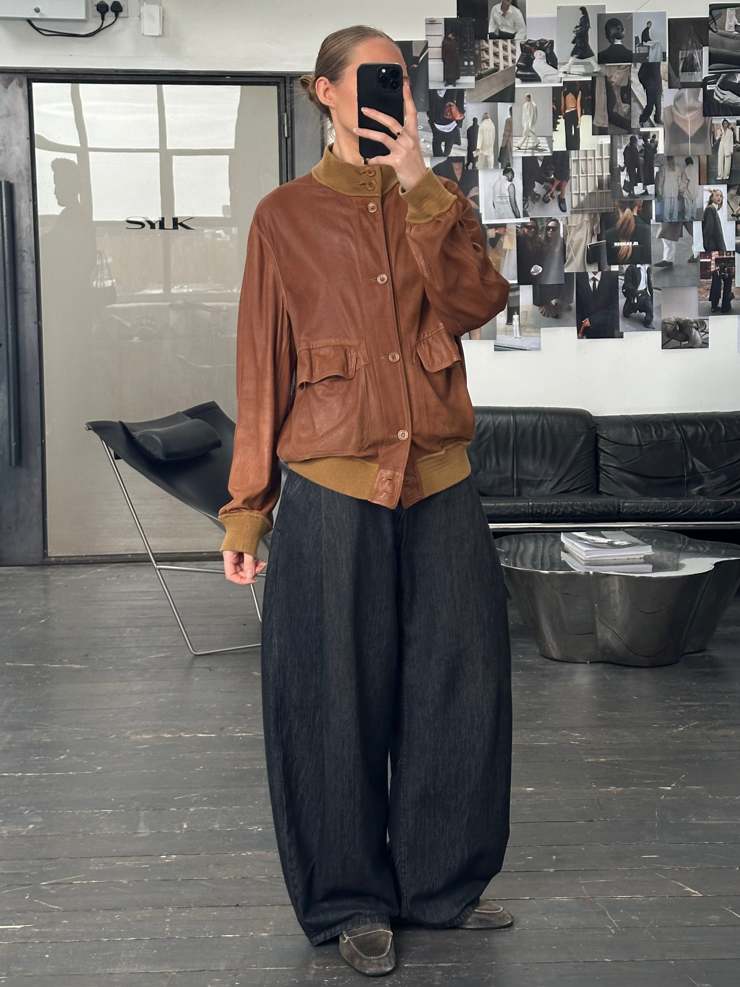 Vintage Italian 1980s reversible suede leather jacket, size large, featuring classic craftsmanship and stylish two-tone design.