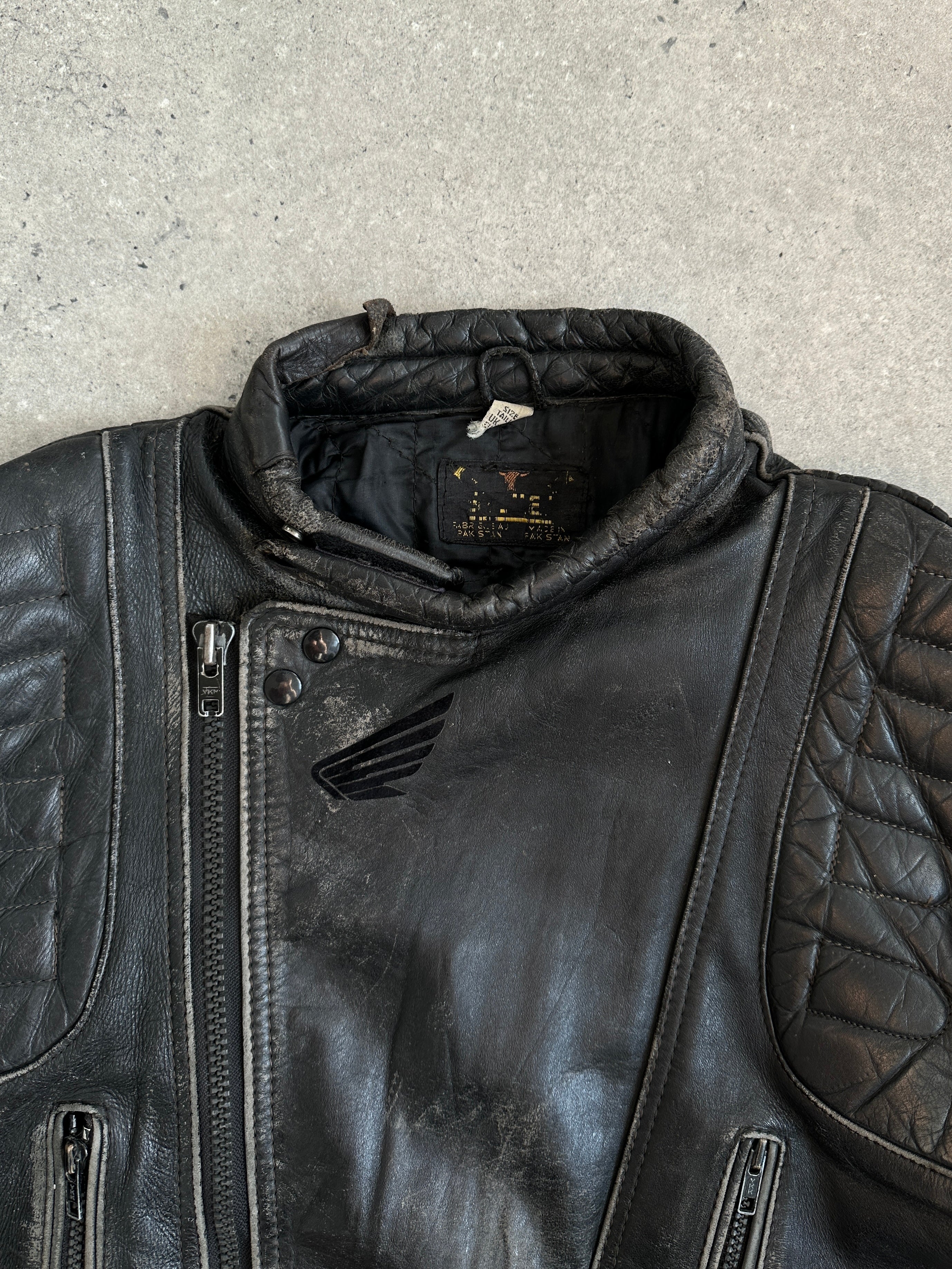 Vintage Motorcycle distressed leather jacket in size M/L, featuring rugged design and classic biker style.