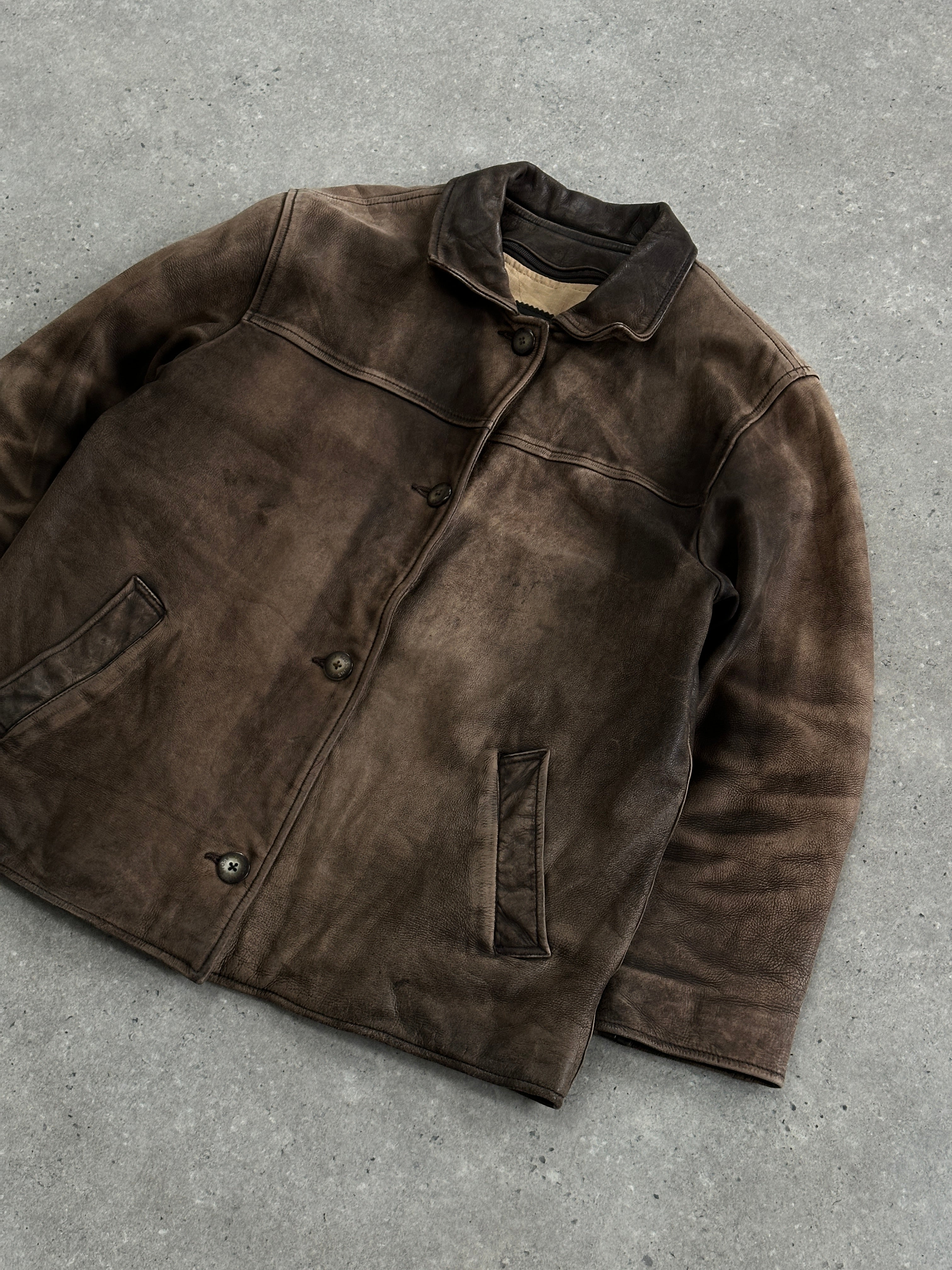 Vintage 1990s distressed leather jacket, size M, featuring rugged, worn-in style and classic design details.
