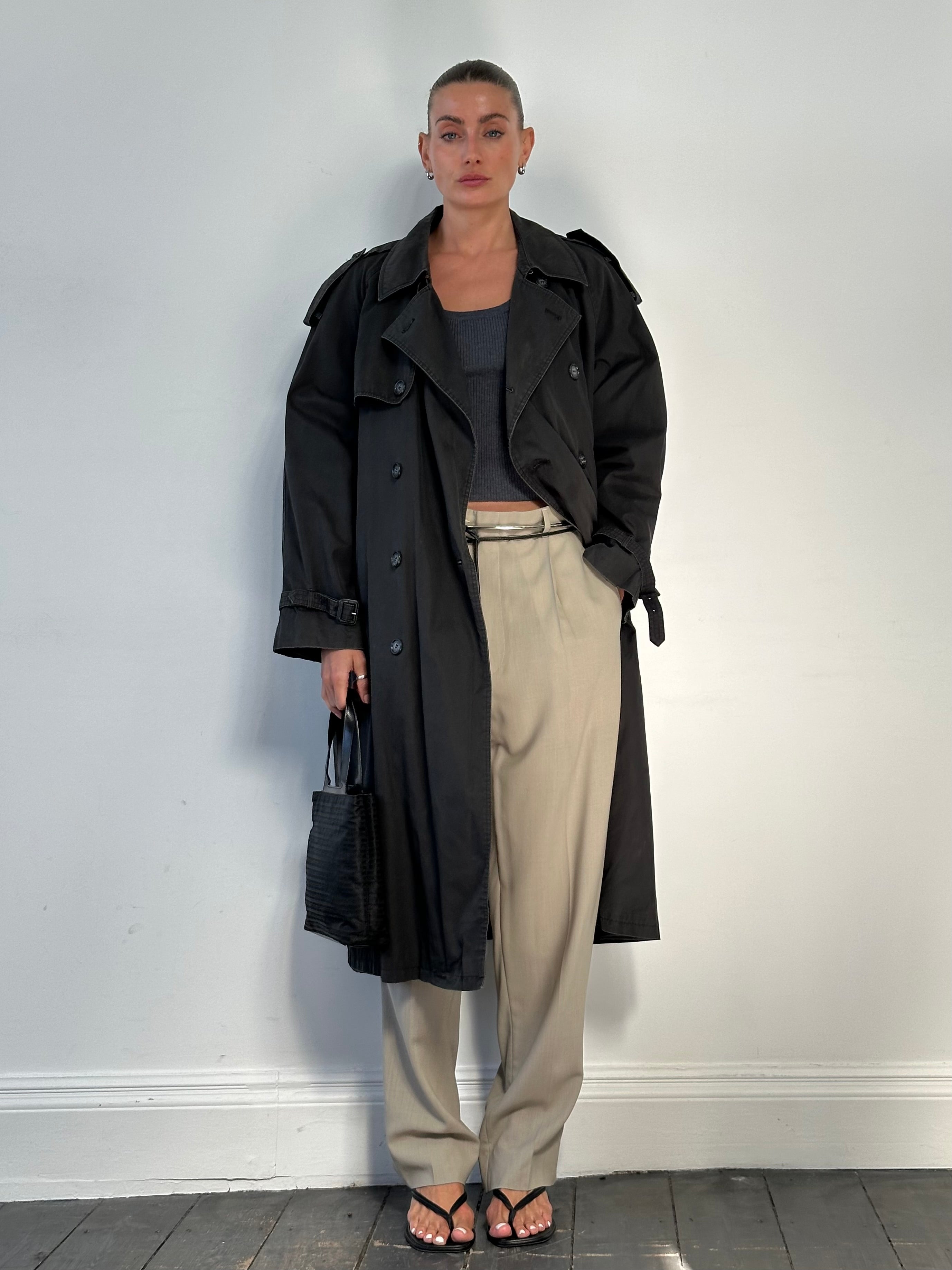 Vintage wool high-waisted straight leg trousers in neutral fabric, laid flat showing front view with waistband and tailored fit.