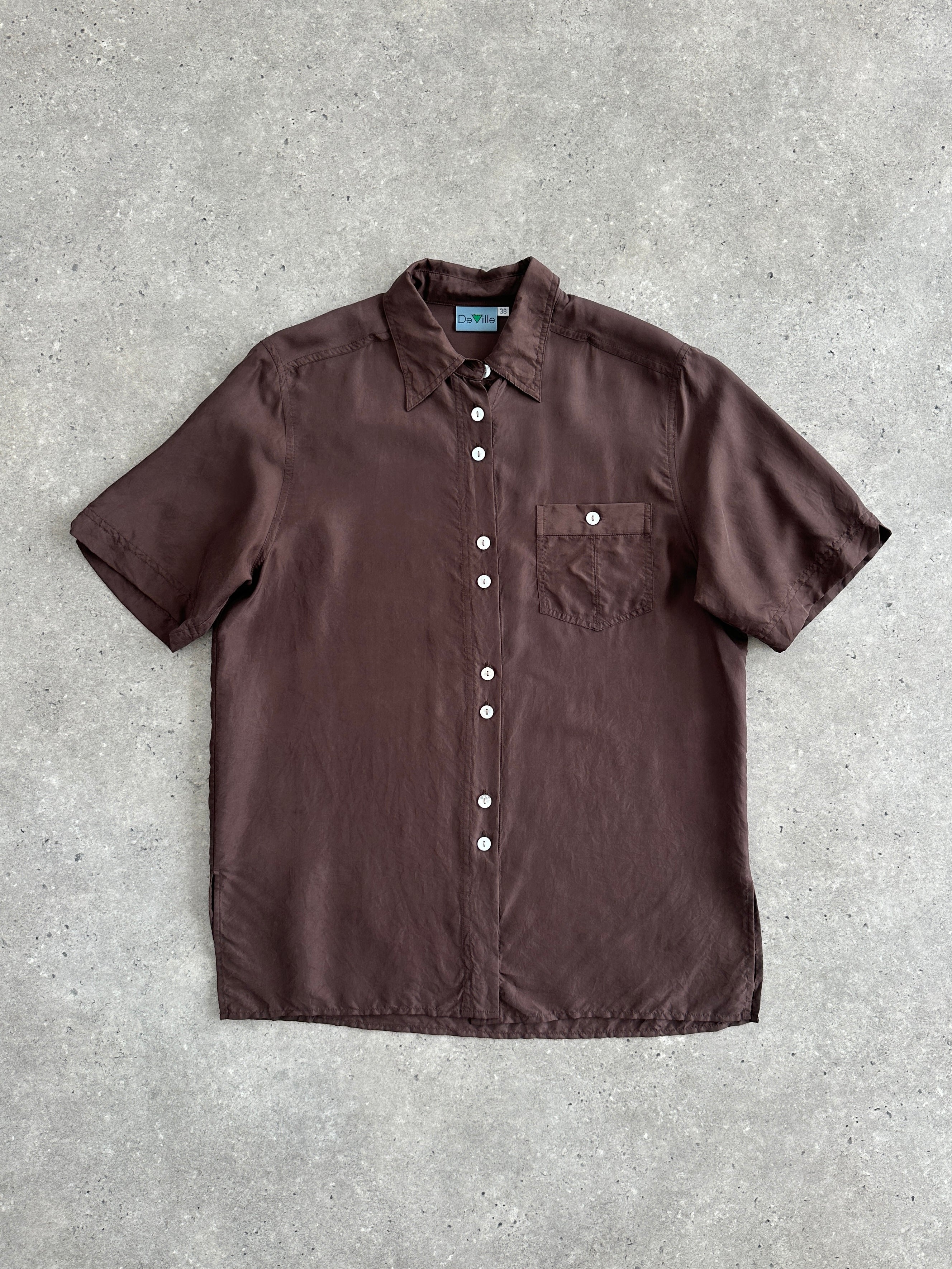 Vintage 1990s pure silk short sleeve shirt, size M, featuring a classic design and smooth fabric, displayed on a neutral background.