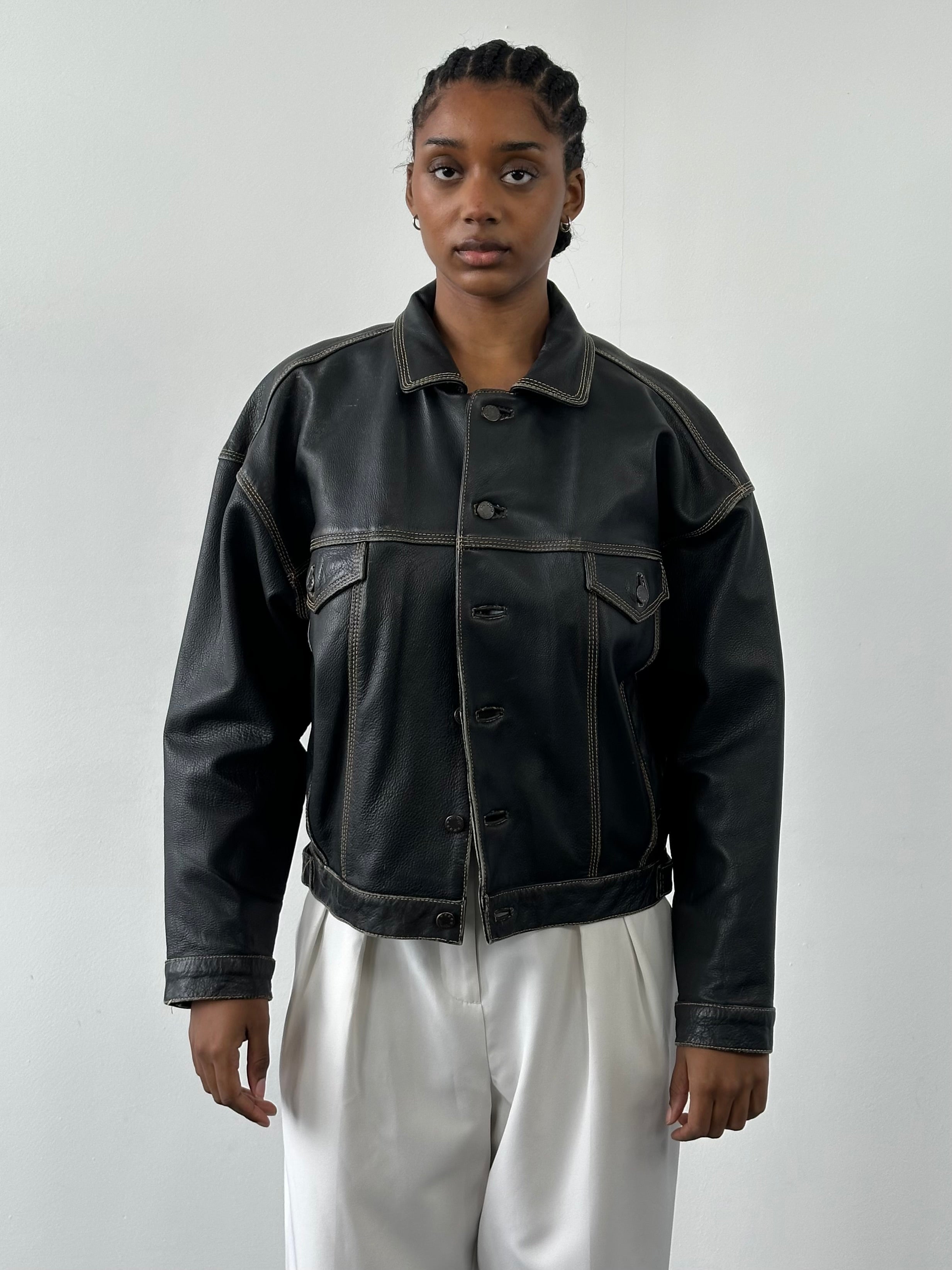 Vintage 1990s leather boxy jacket with collar and button details, black leather, size M/L, stylish retro outerwear.