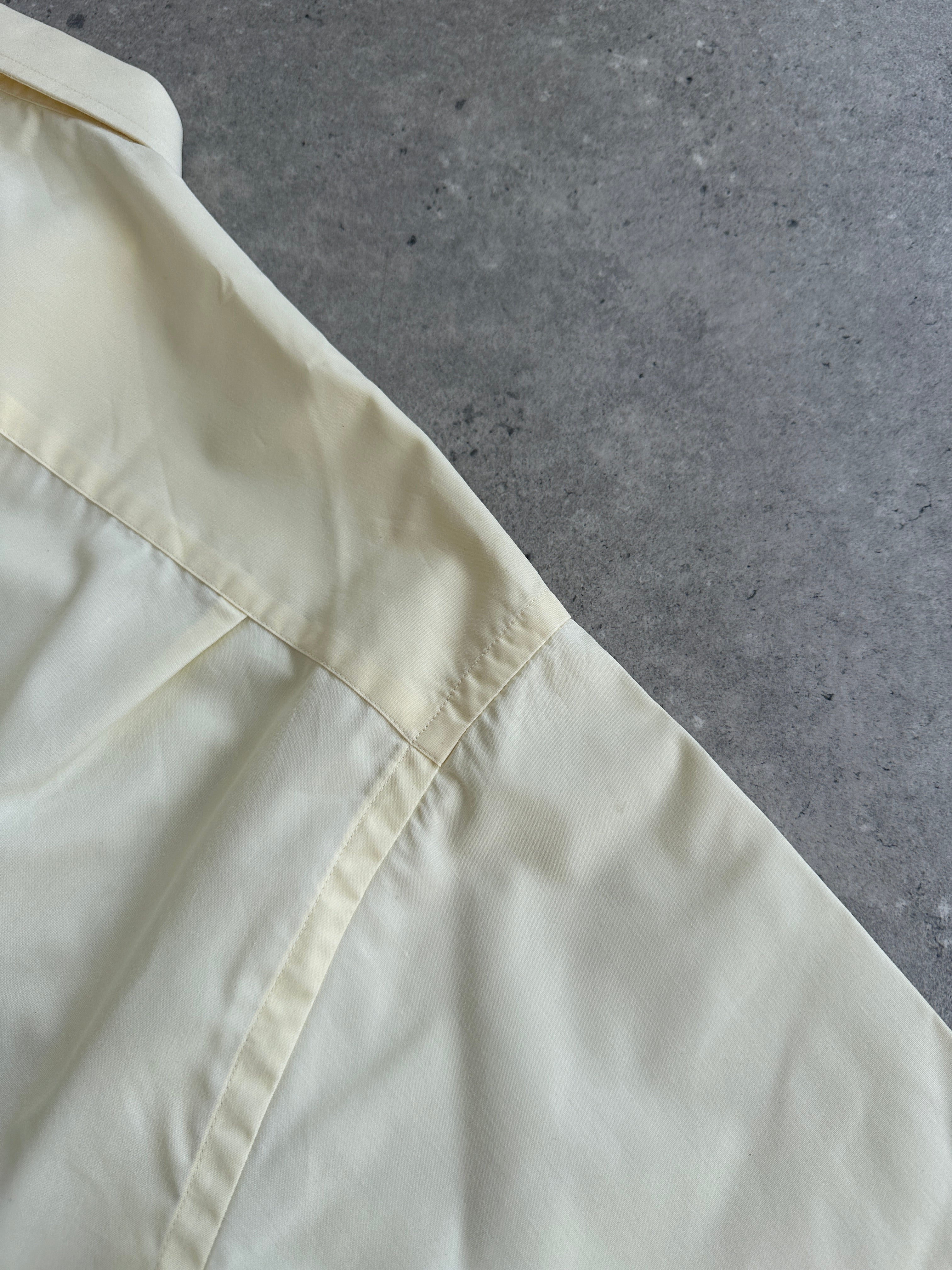 Yves Saint Laurent Pour Homme 1990s cotton short sleeve logo shirt in size L, featuring a classic design and iconic branding.