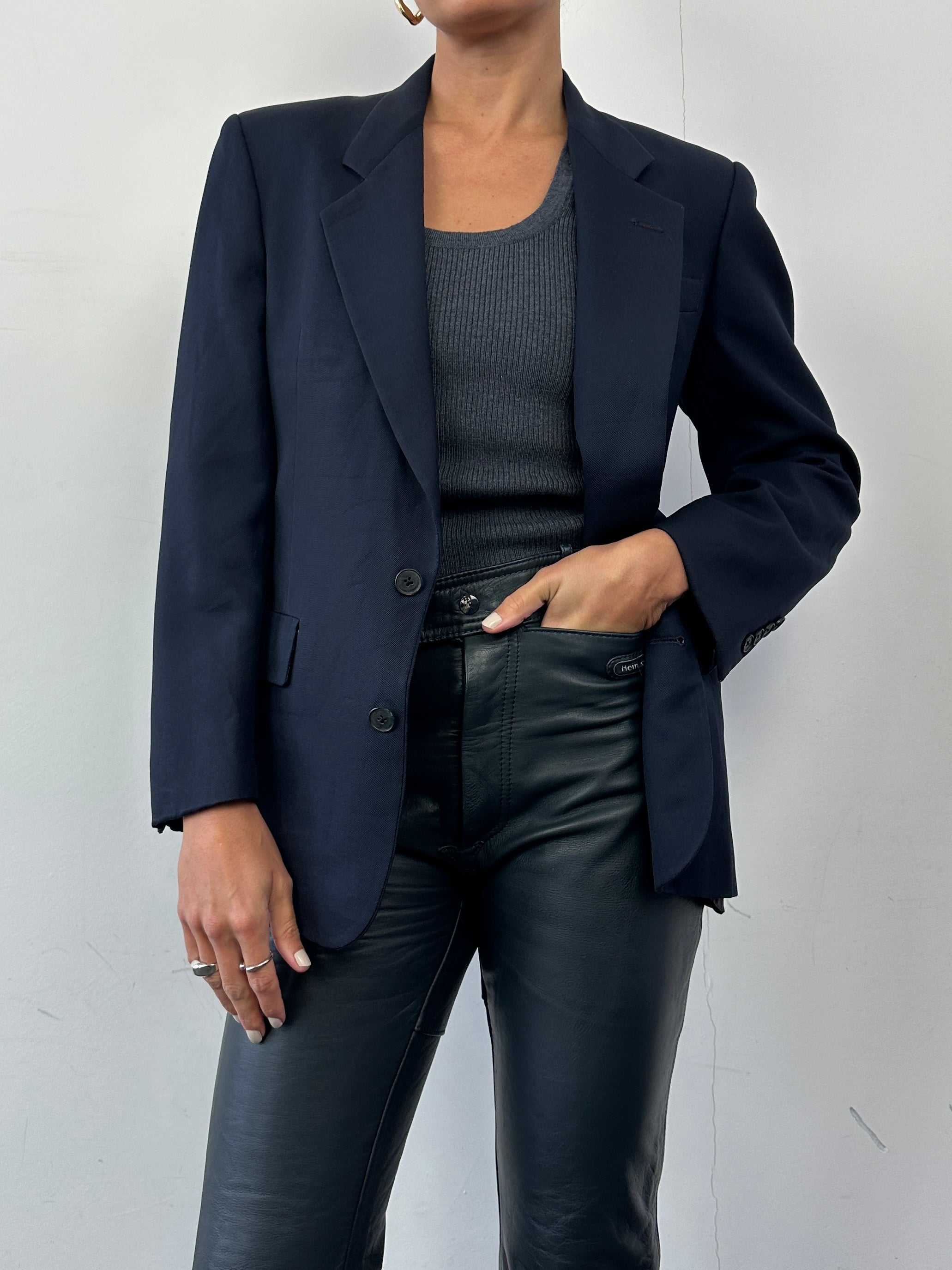 Christian Dior wool single-breasted blazer in XS/S, tailored fit, dark color, featuring classic lapels and structured design.