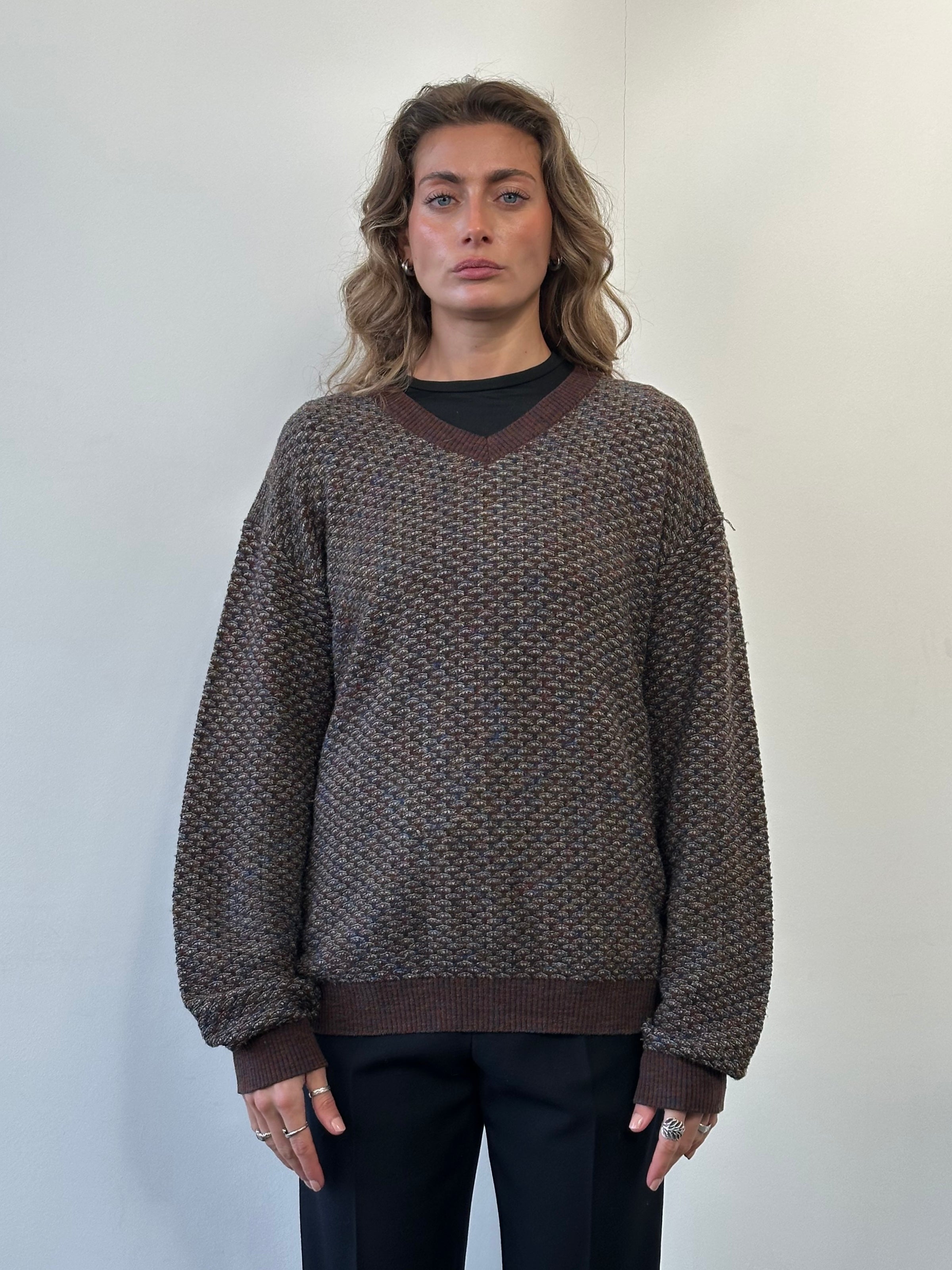 Missoni V neck wool knitted jumper in size L, featuring a colorful zigzag pattern and cozy knit texture.