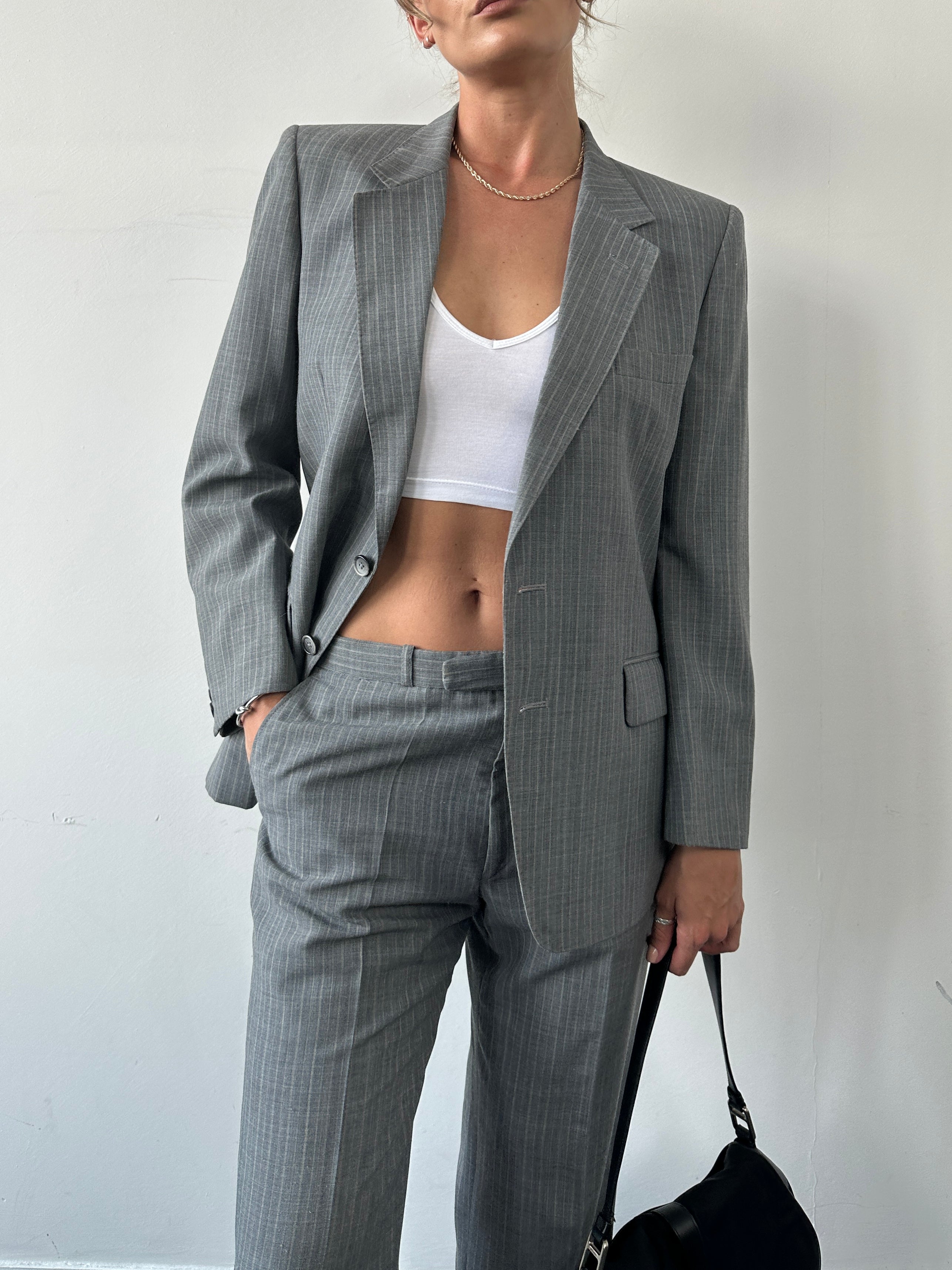 Christian Dior Monsieur pinstripe wool single-breasted suit in size 40S/W34, displayed on a mannequin.