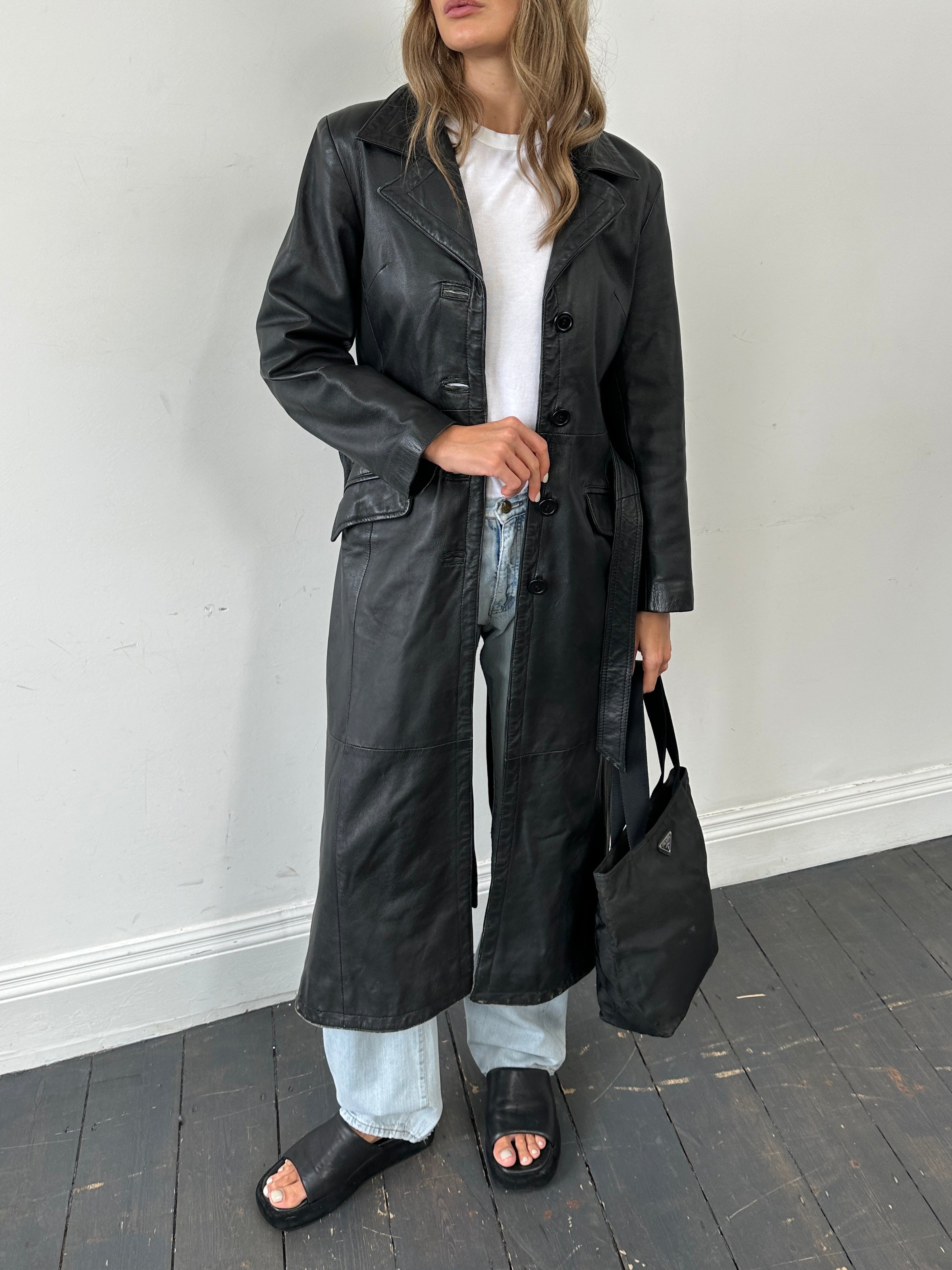Vintage leather belted trench coat, floor length jacket in size small, featuring classic design and timeless style.